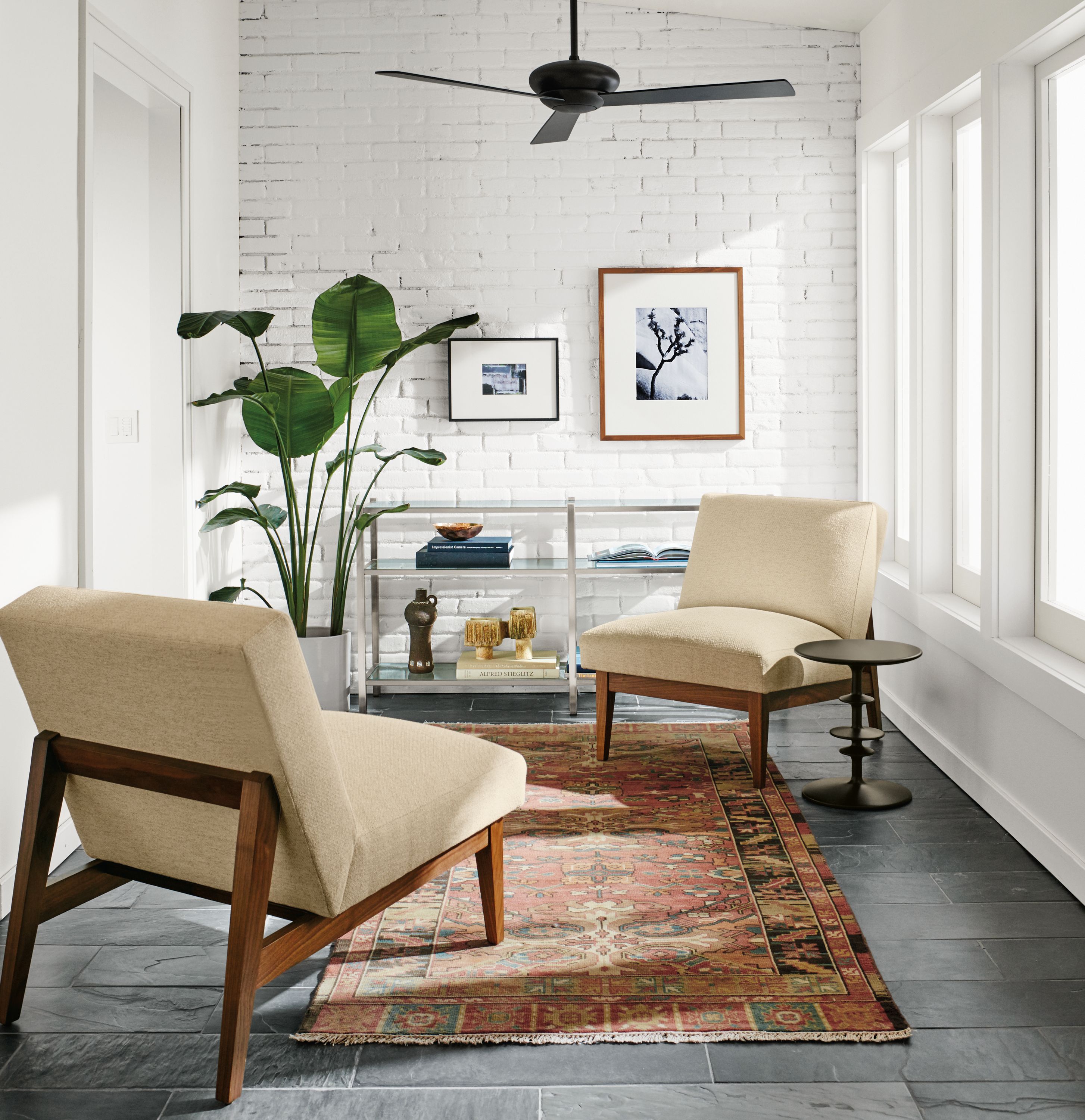 Detail of two Edwin accent chairs.