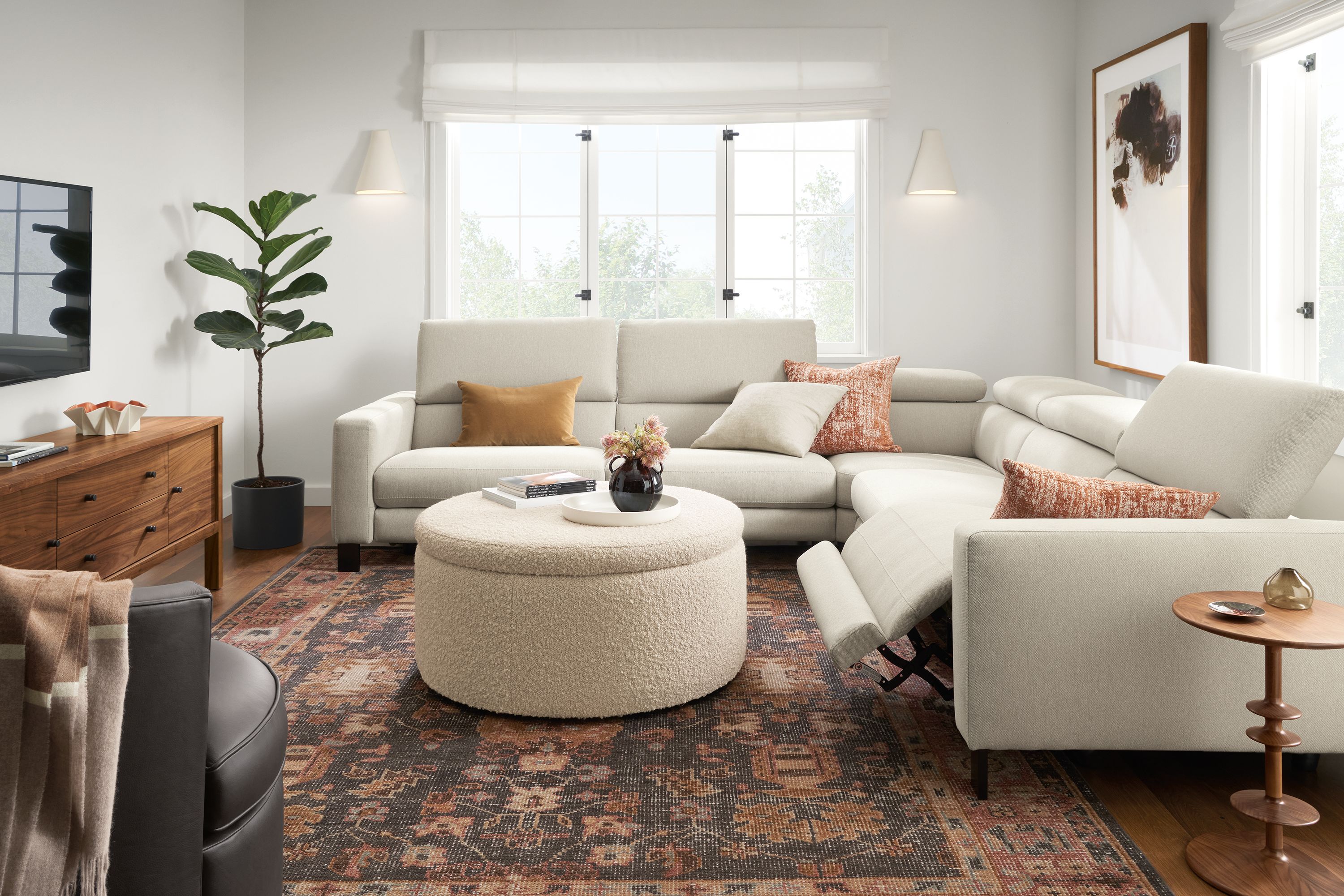 Living room with Elio sectional in sussex fabric with one seat in reclining position.