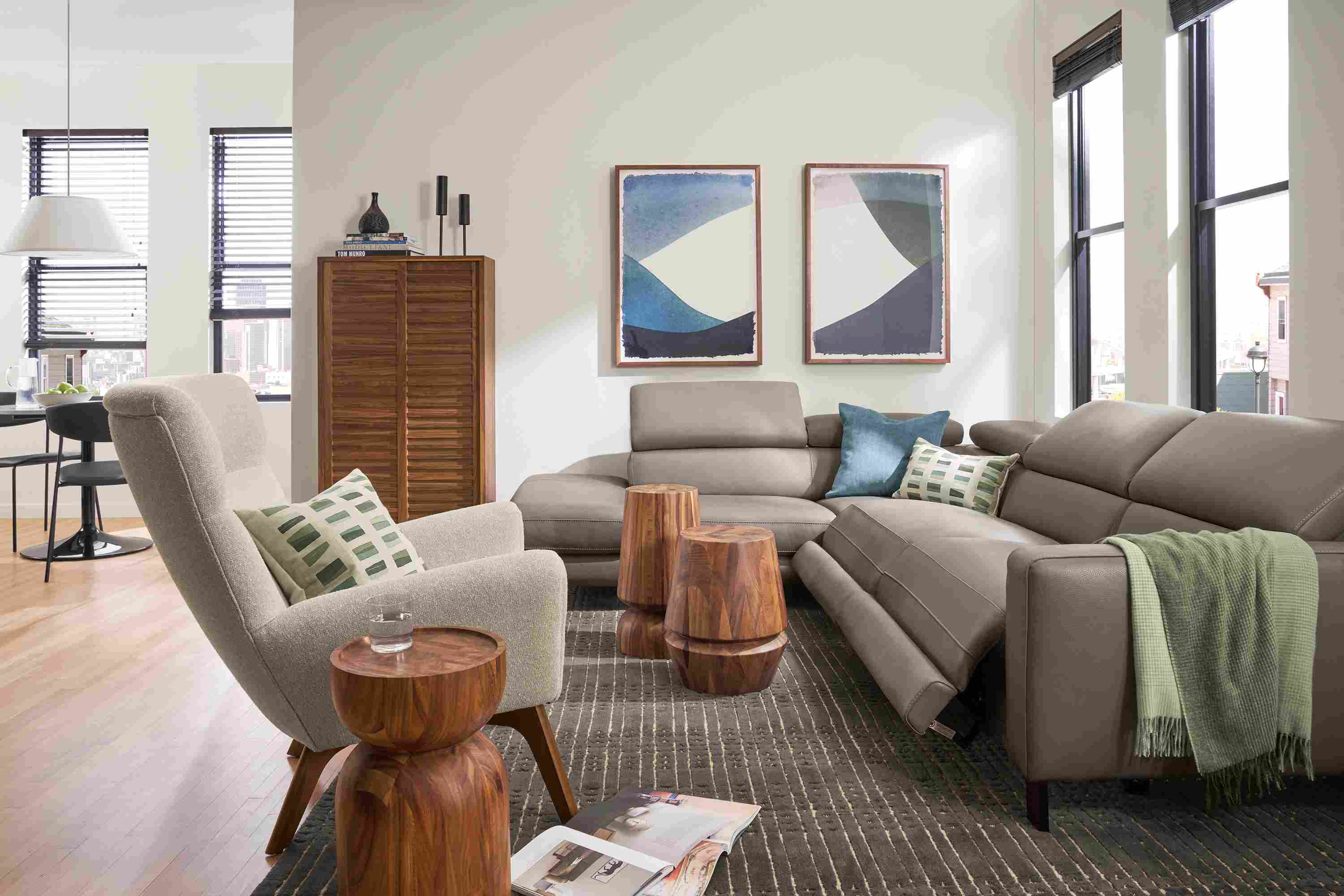 Living room with Elio leather in dario smoke sectional with three headrests and two footrests extended.