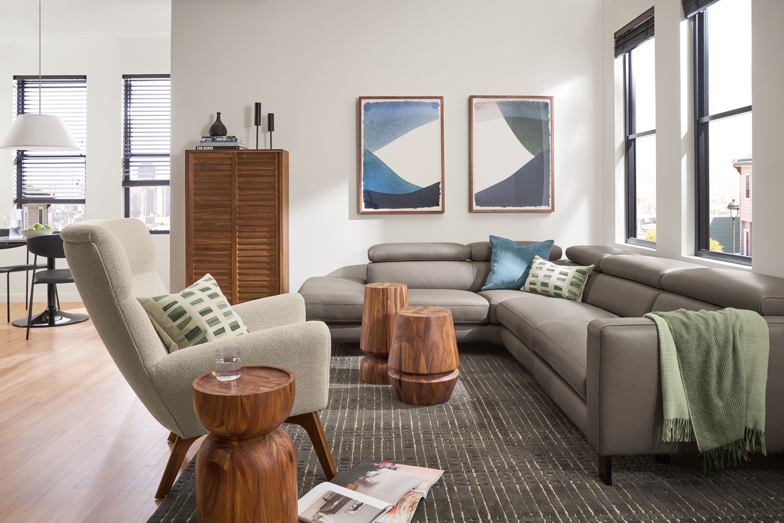 Living room with Elio leather sectional, boden chair, nyla tables.