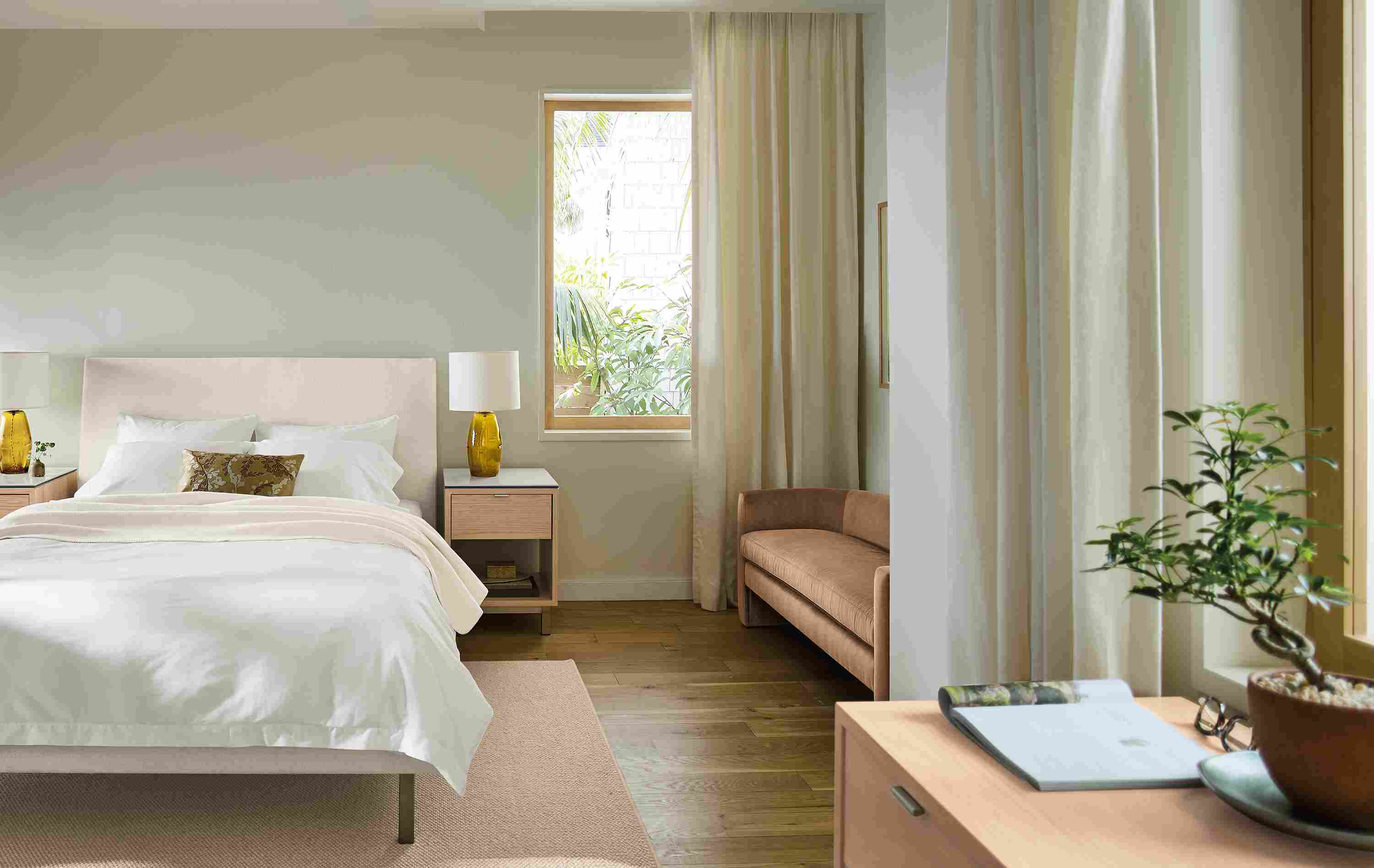 Bedroom with Ella bed in tepic white, 2 Copenhagen nightstands in salt on red oak and Flannery rug in oatmeal.