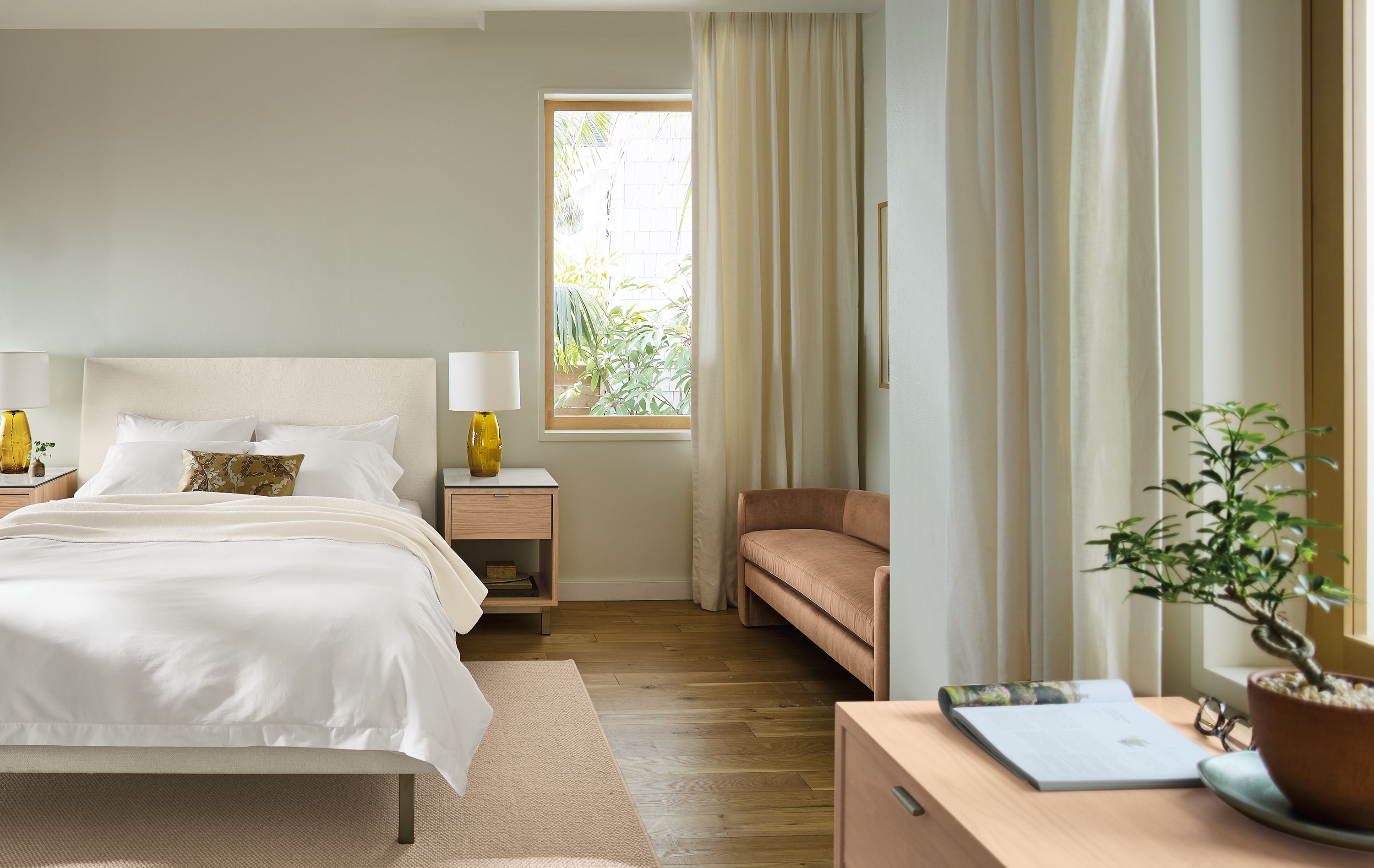 Bedroom with Ella bed in tepic white, 2 Copenhagen nightstands in salt on red oak and Flannery rug in oatmeal.