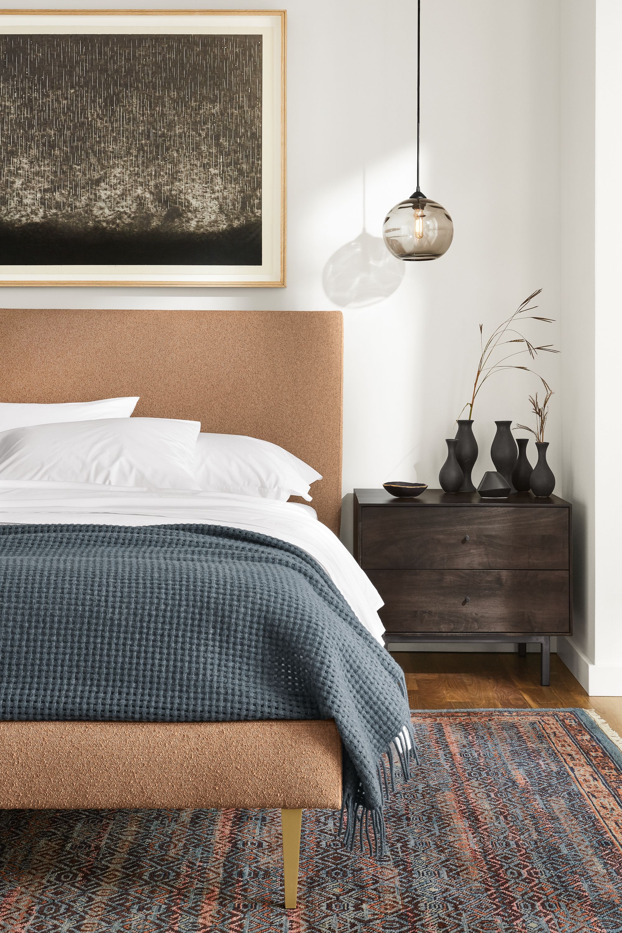 Close-up of Ella queen bed in Declan Sienna fabric beside Hudson nightstand.