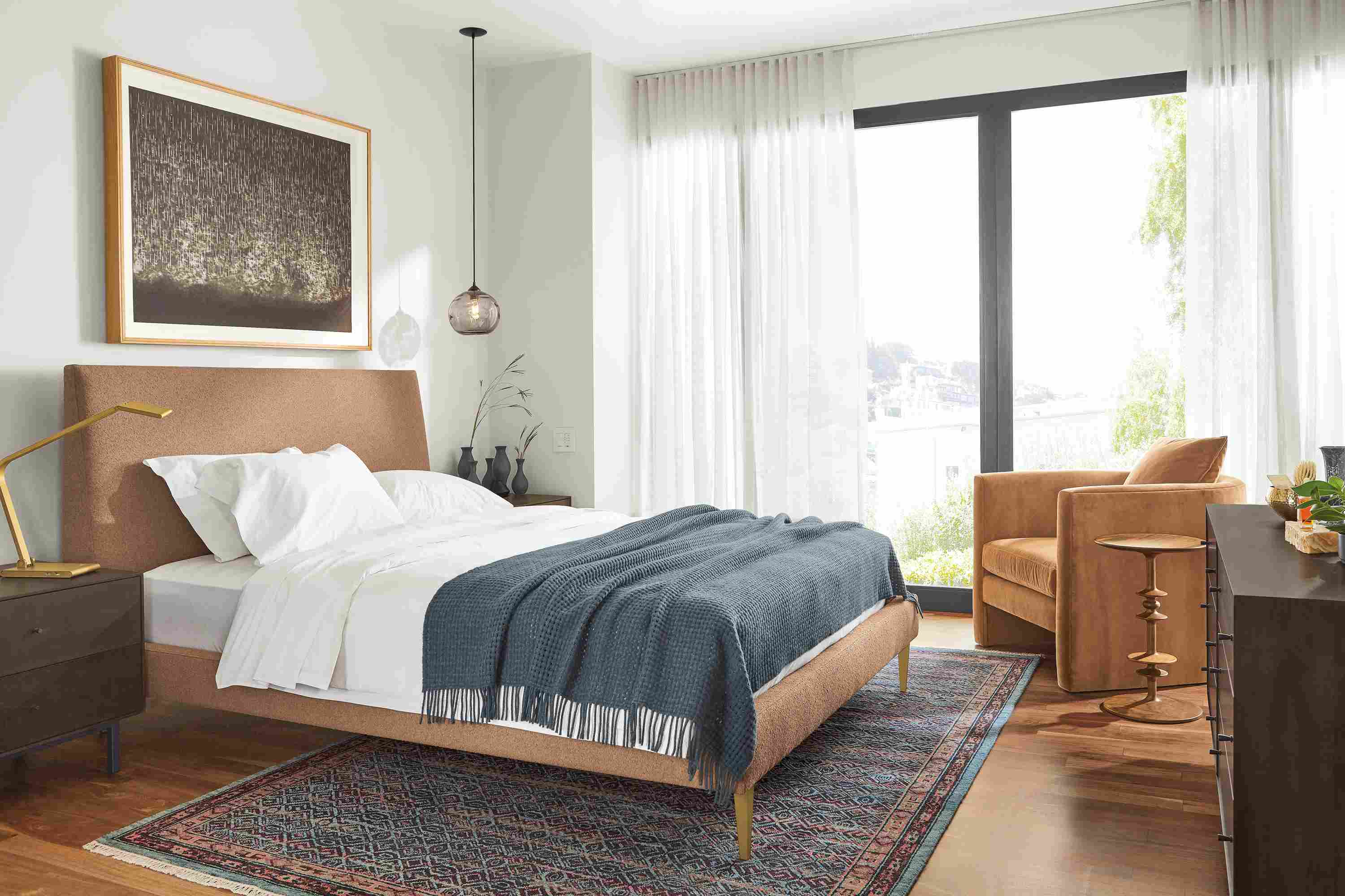 Detail of Ella queen bed in Declan Sienna fabric in bedroom.