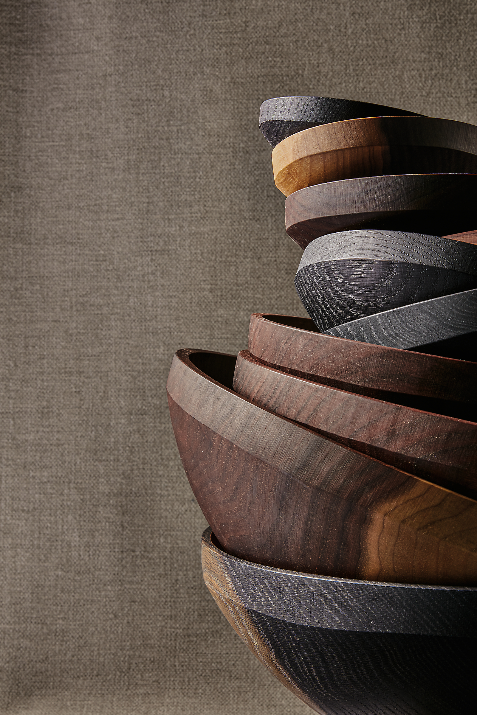 Detail of stack of Calder bowls in various sizes and finishes.