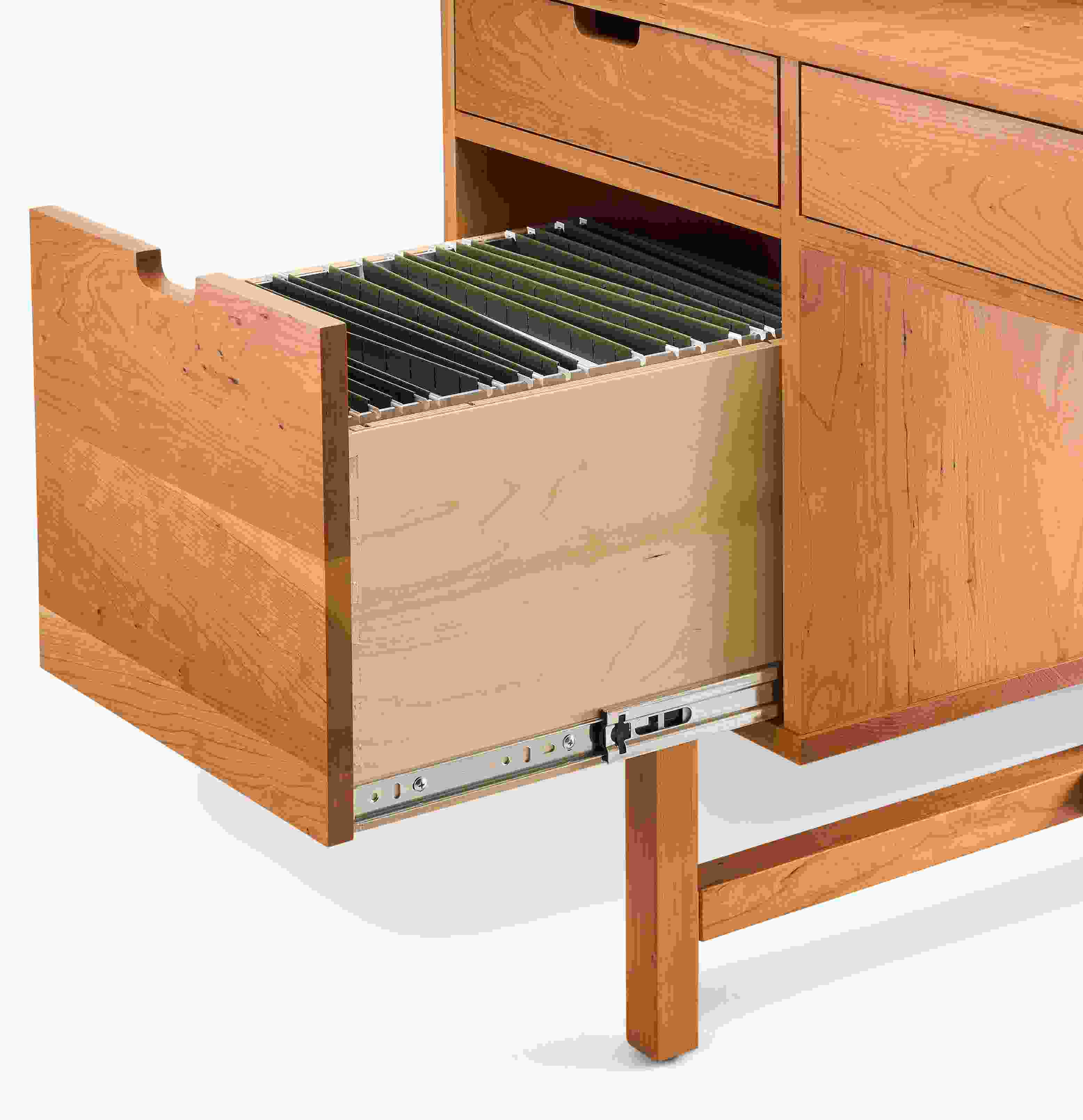 Close-up of open file drawer on an Ellis desk in cherry showing letter size file folders.