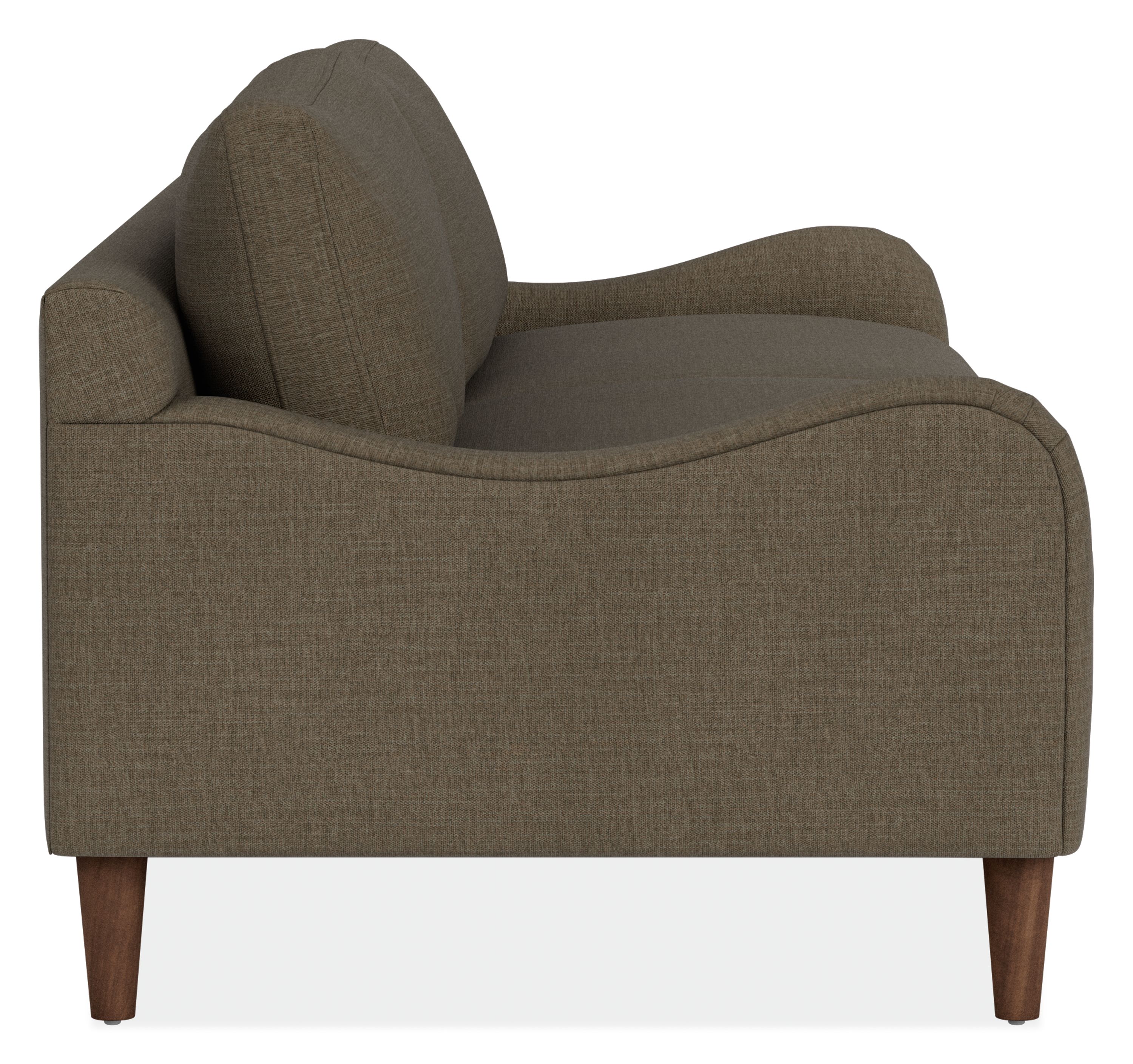 Side view of Eloise 87 Sofa in Mori Olive Fabric with Mocha-stained  taper legs.