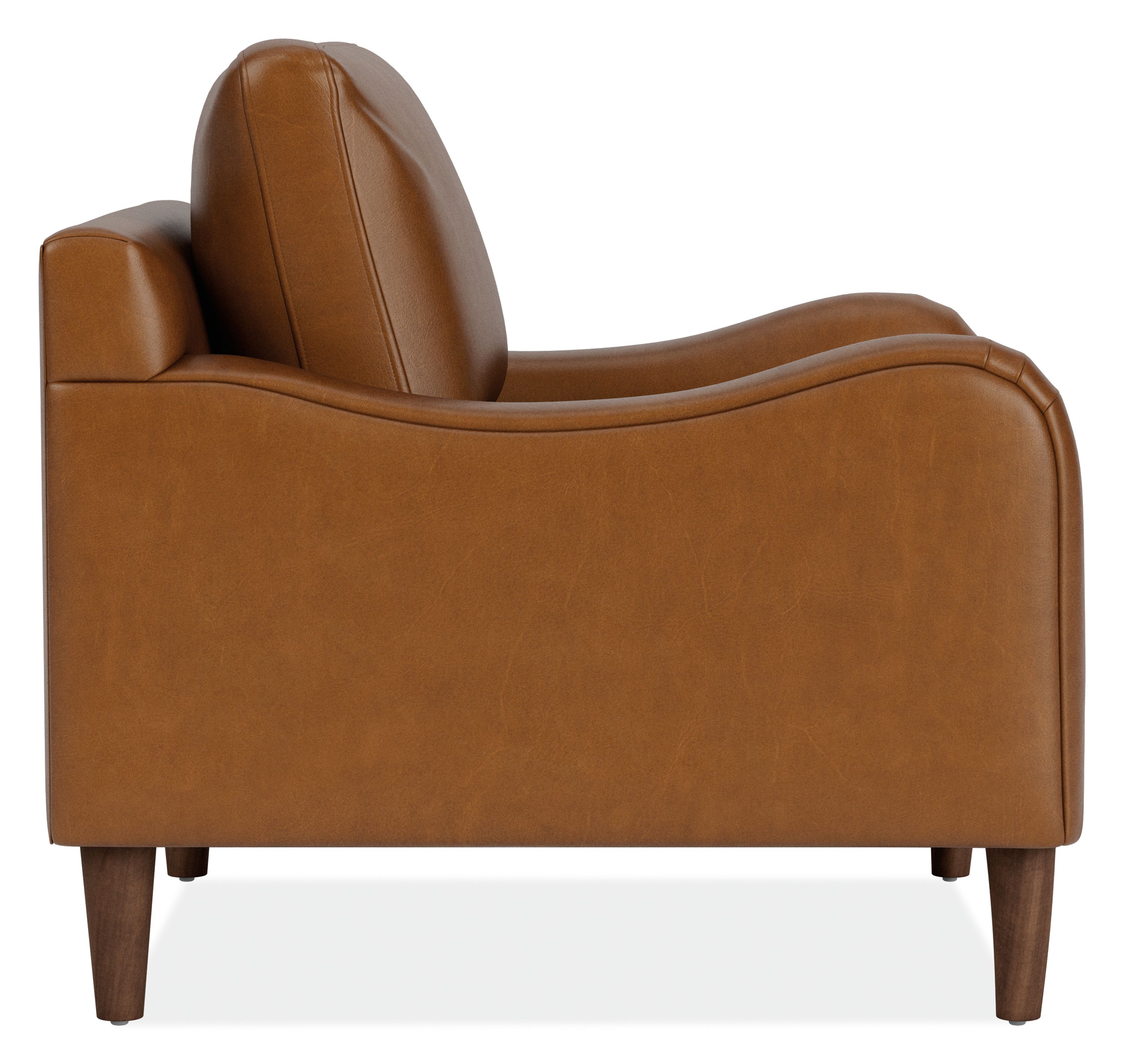 Side view of Eloise Chair in Vento Cognac Leather with Mocha-stained  taper legs.