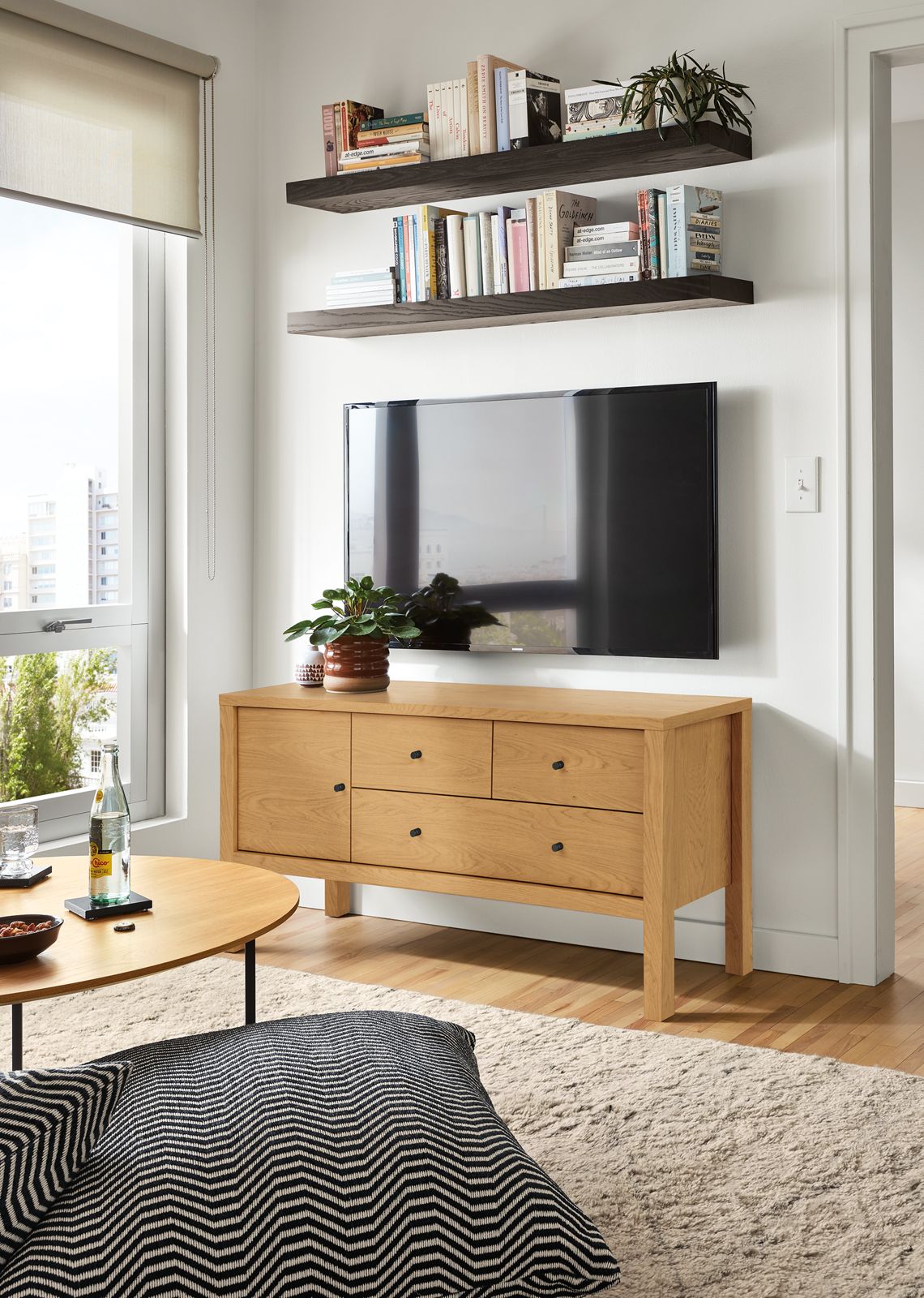 Room setting featuring the Emerson 48-wide media cabinet in white oak.