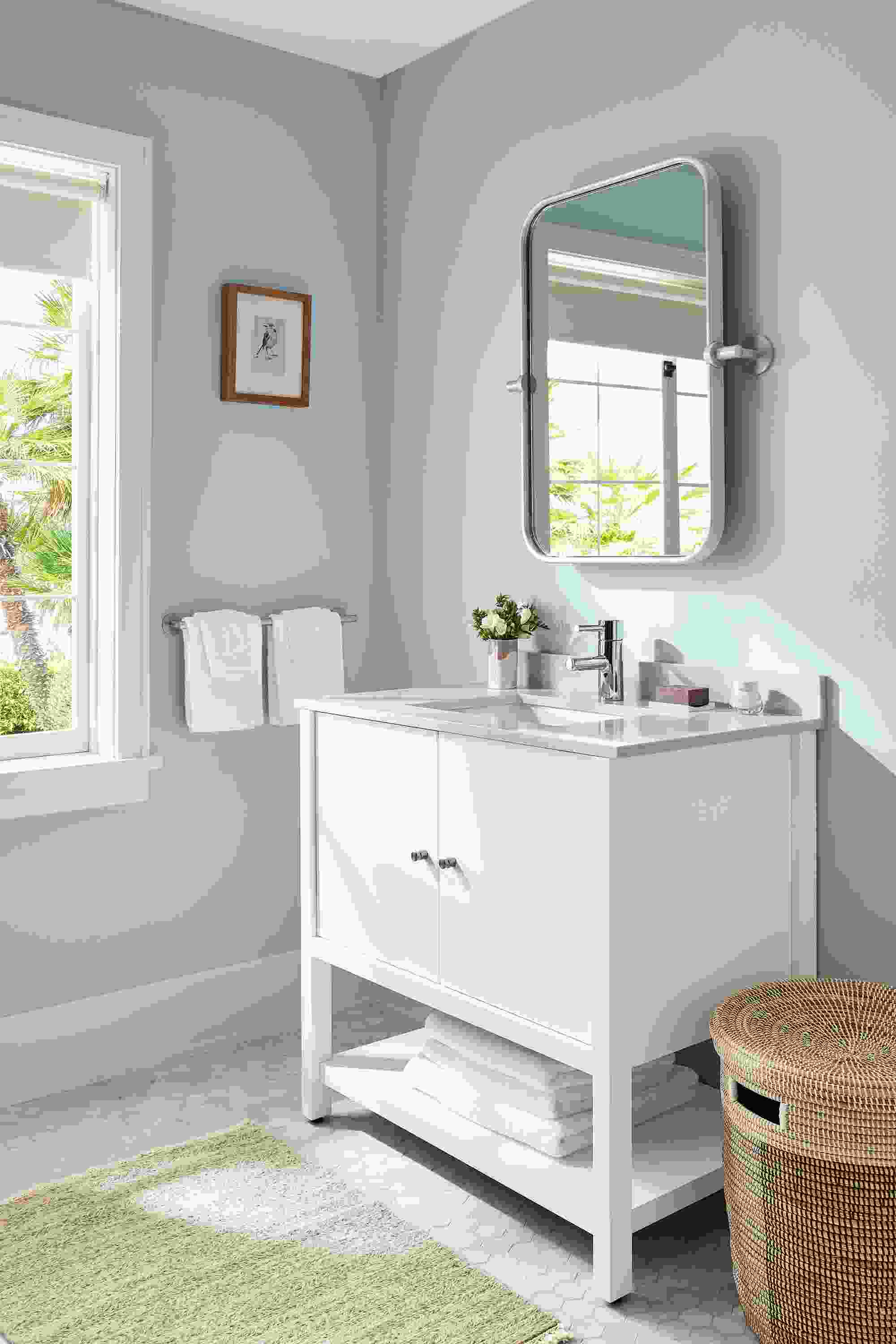 bathroom with emerson vanity in white in bathroom with lilia mirror.