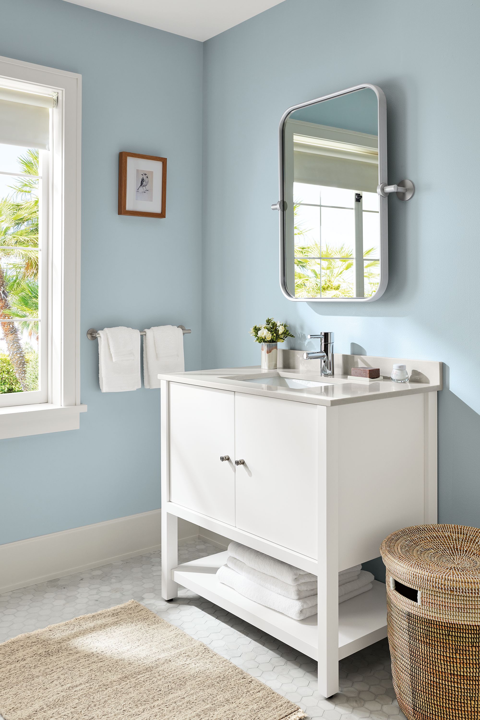 bathroom with emerson vanity in white in bathroom with lilia mirror.