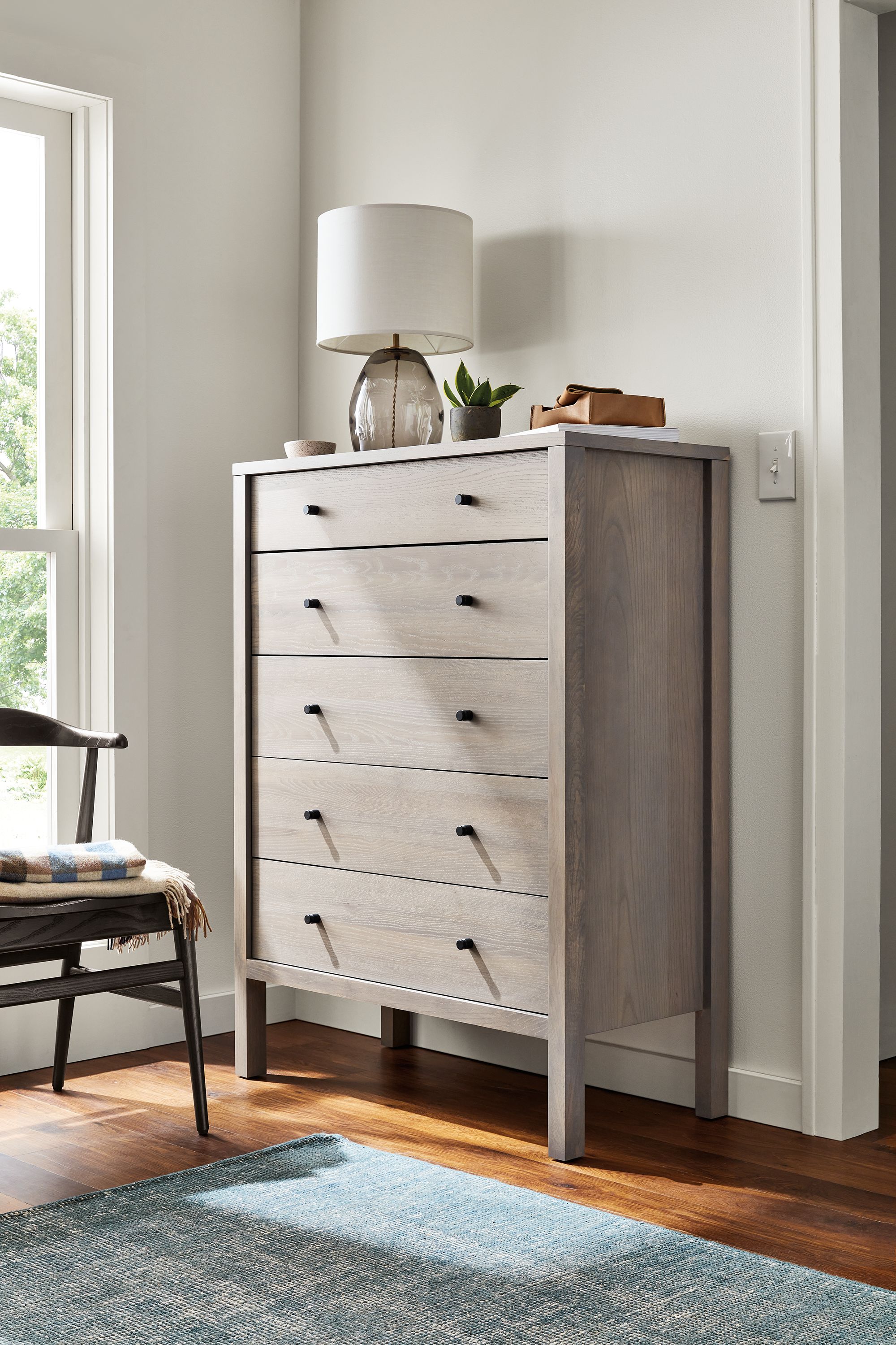 detail of emerson five-drawer dresser in shell in bedroom.