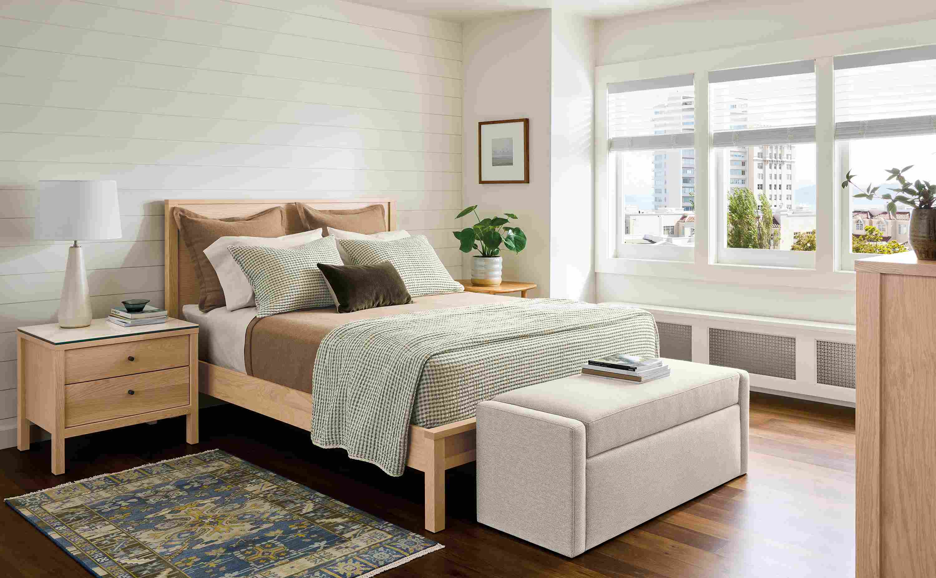 Bedroom with Emerson queen bed, dresser and nightstand in salt on red oak.