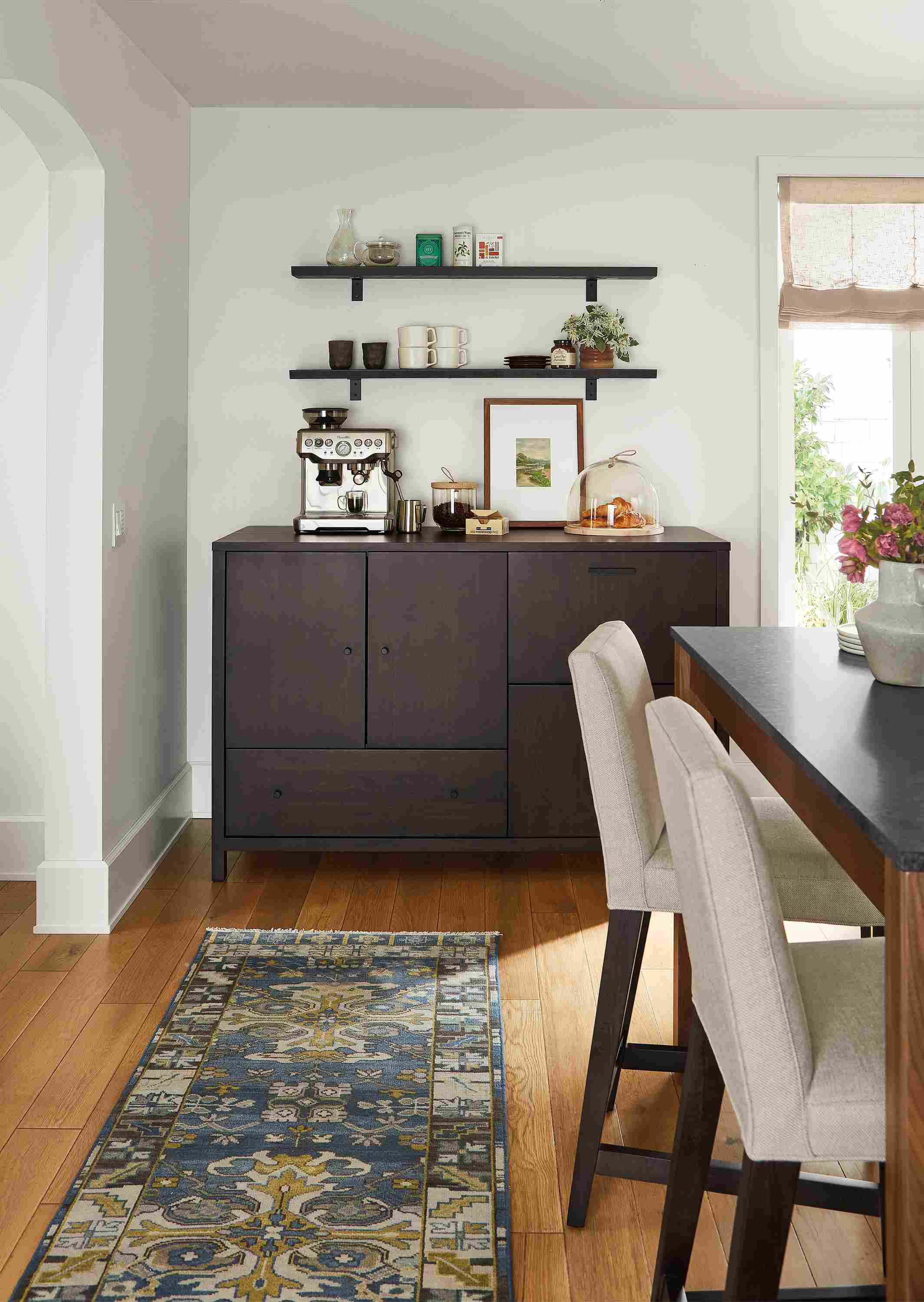 Dining area with Emerson 60-wide fridge cabinet with 2  drawers, Ava counter stools Linden counter table.