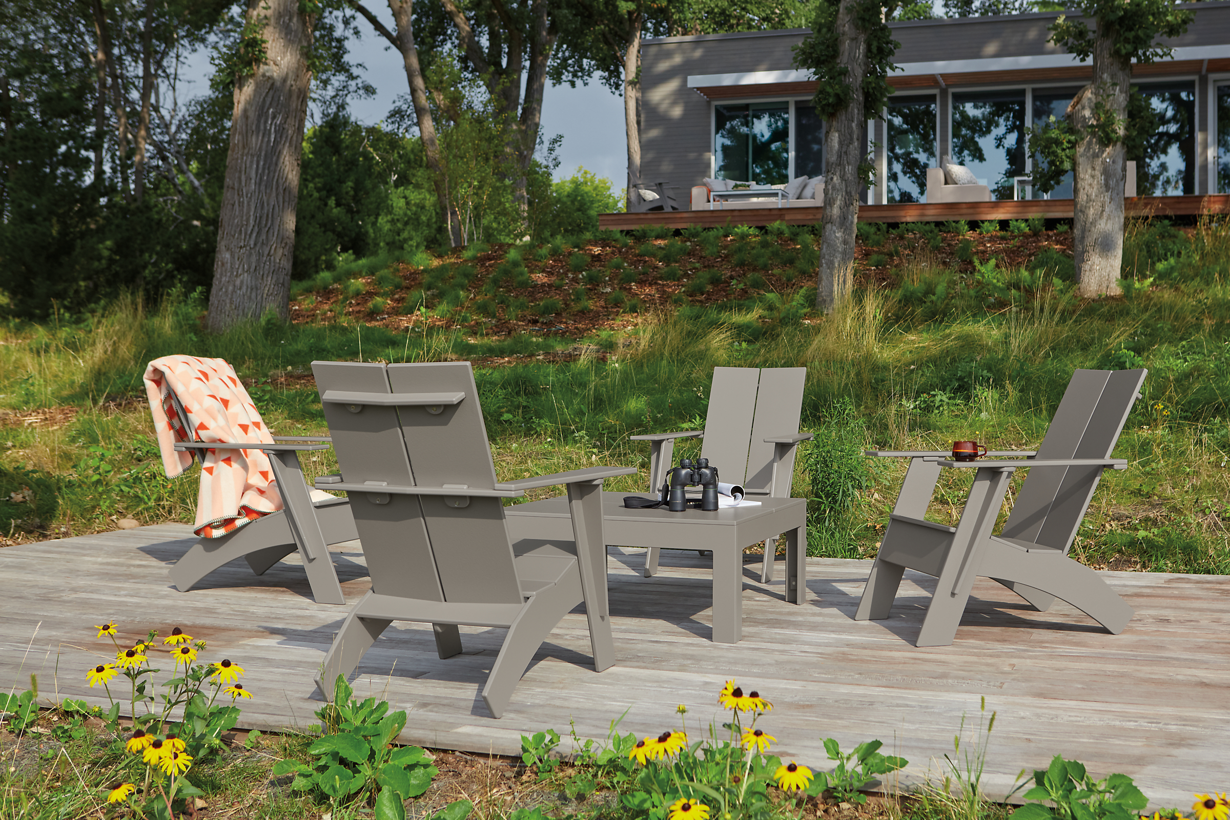 Outdoor space with Emmet lounge chairs in putty and Henry coffee table in putty.