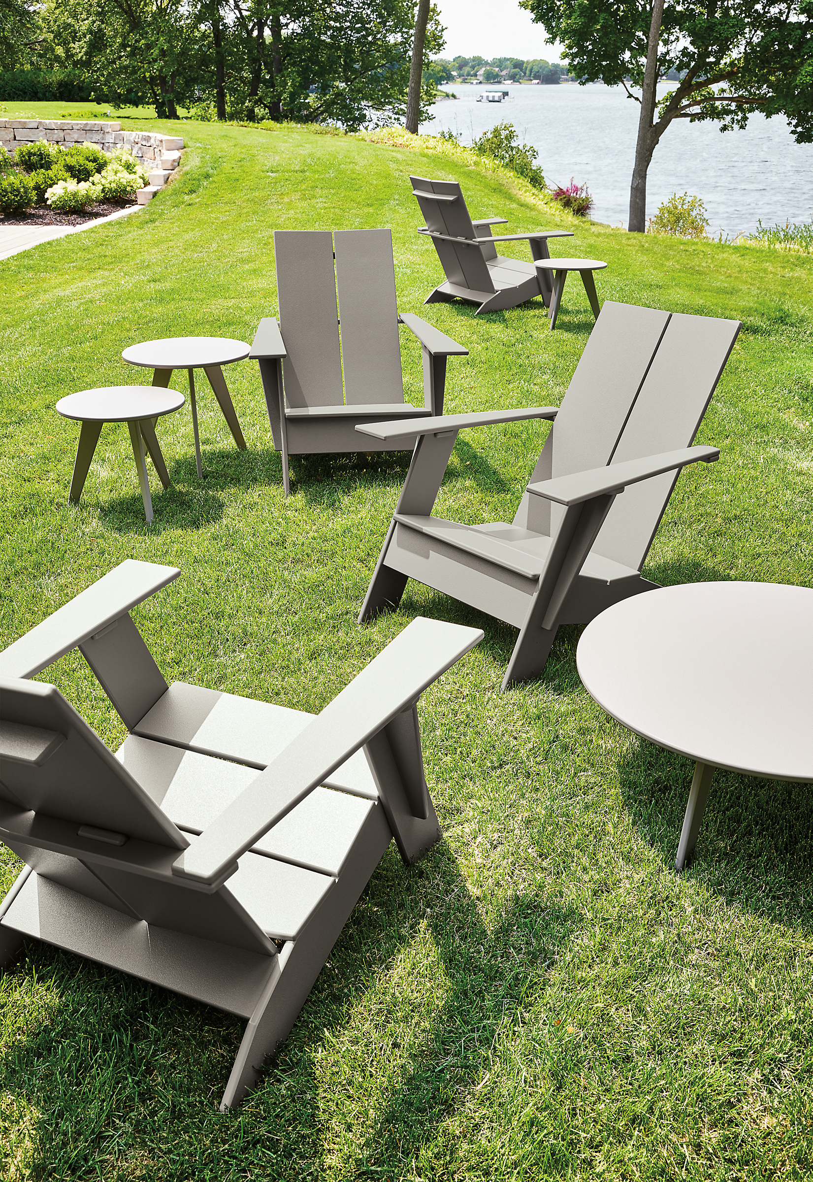 lawn with several emmet chairs and nova tables in putty.