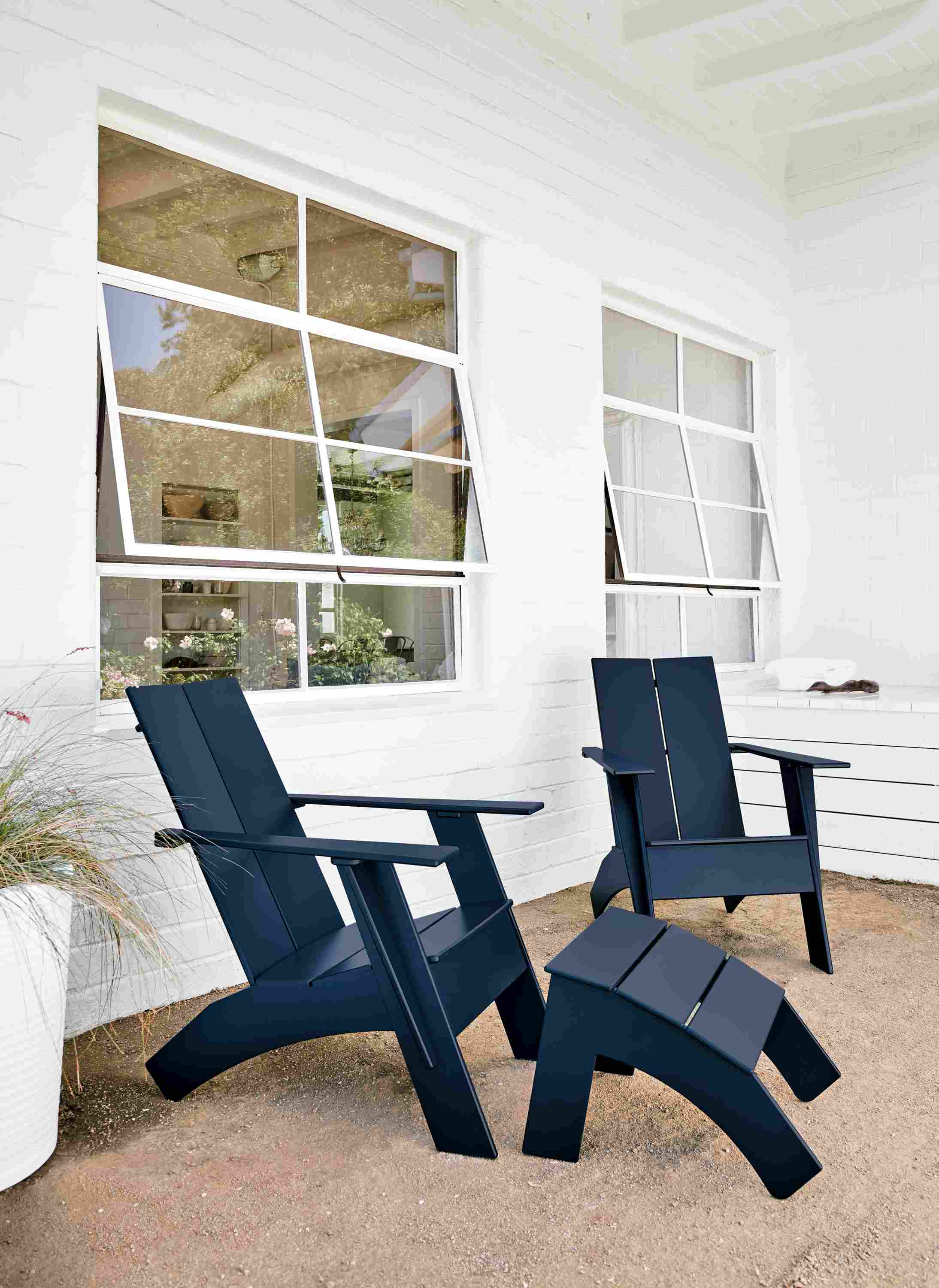 Patio with Emmet tall lounge chair in navy.