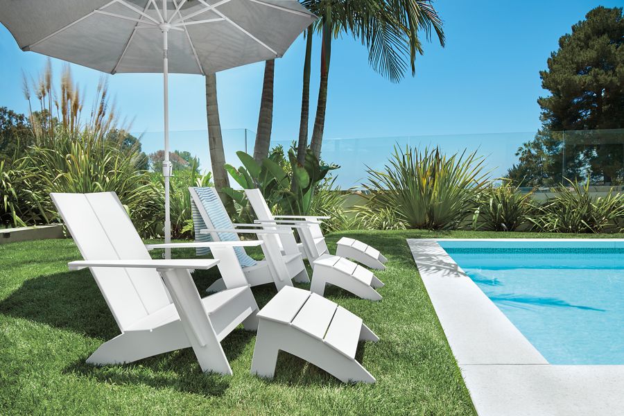 Three Emmet lounge chairs with umbrella.