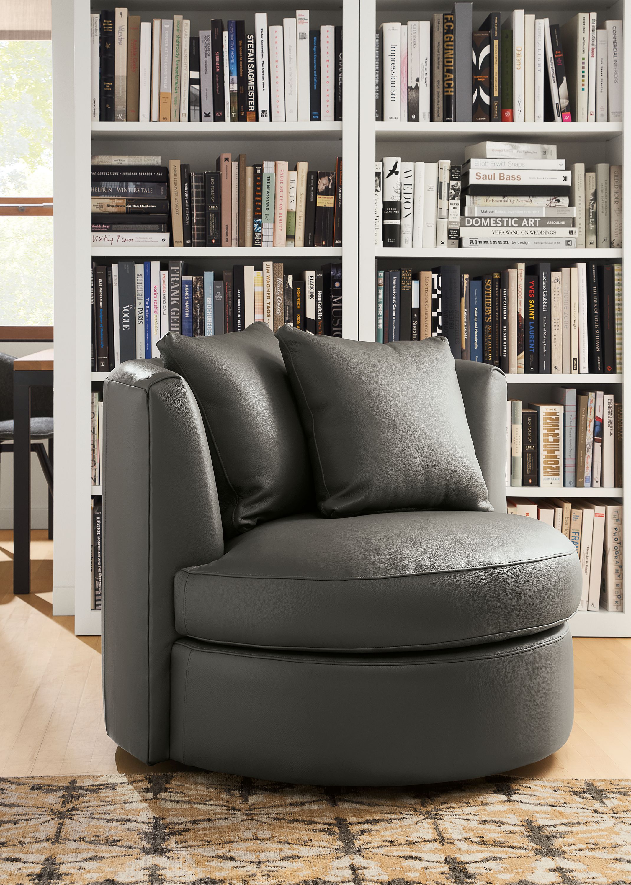 Seating area with Eos 42-wide swivel chair in Urbino Smoke leather.