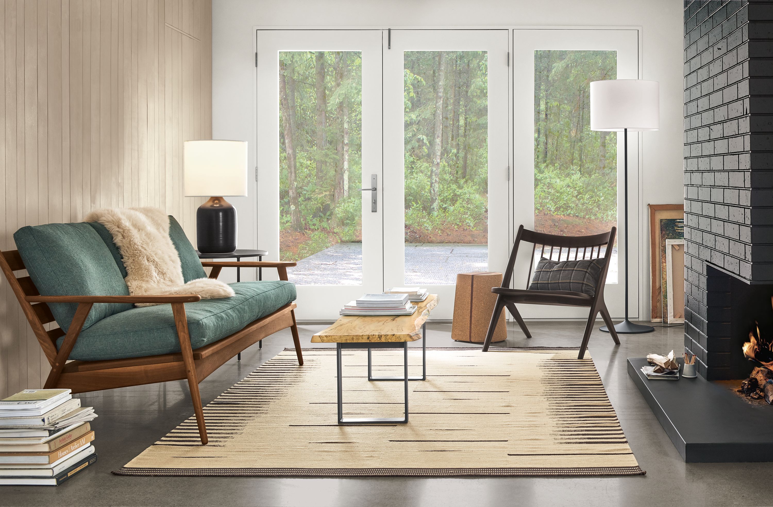 Detail of Ericson sofa in walnut with Sumner Lagoon fabric cushions in living room.
