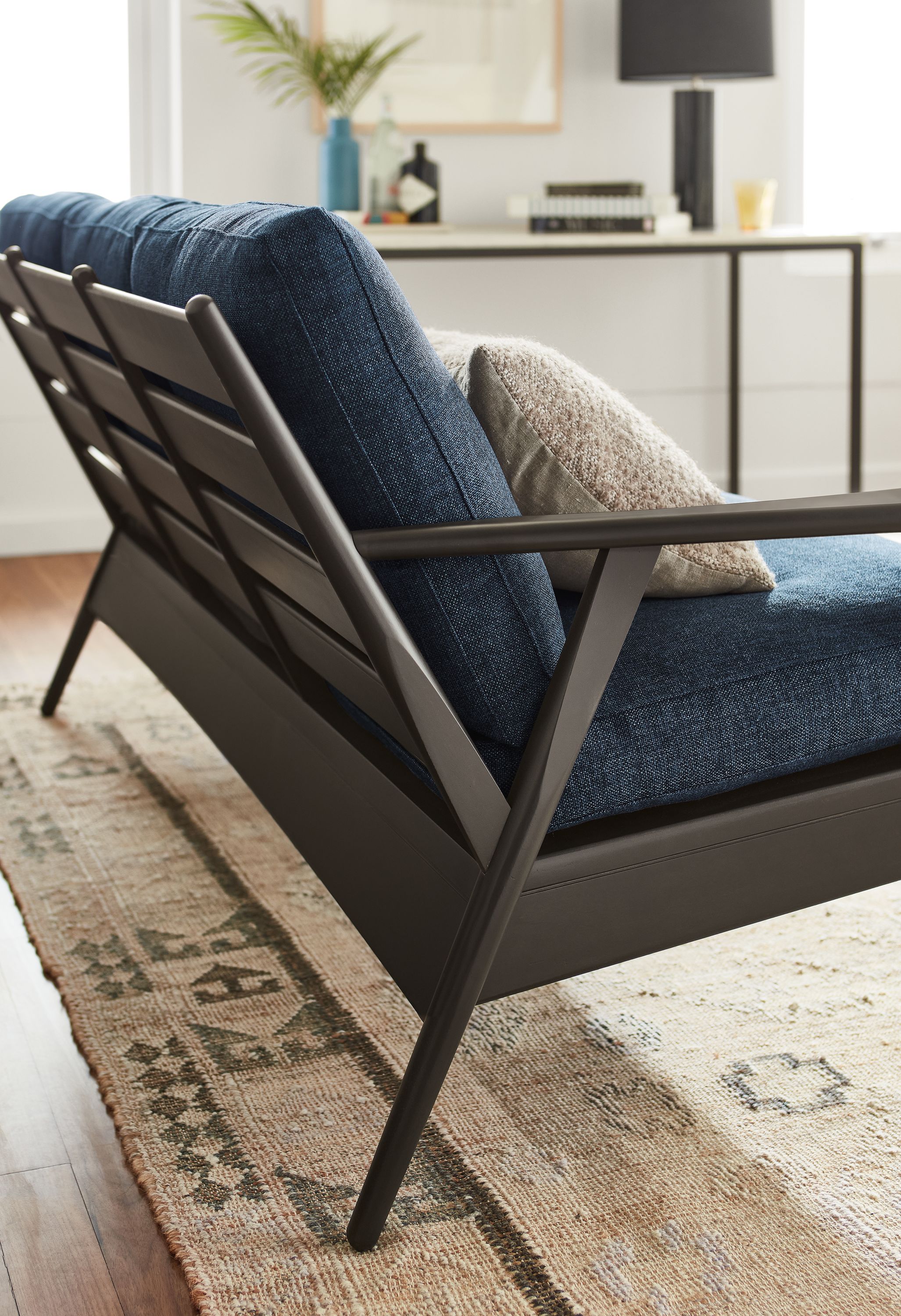 detail of back of ericson sofa in charcoal.