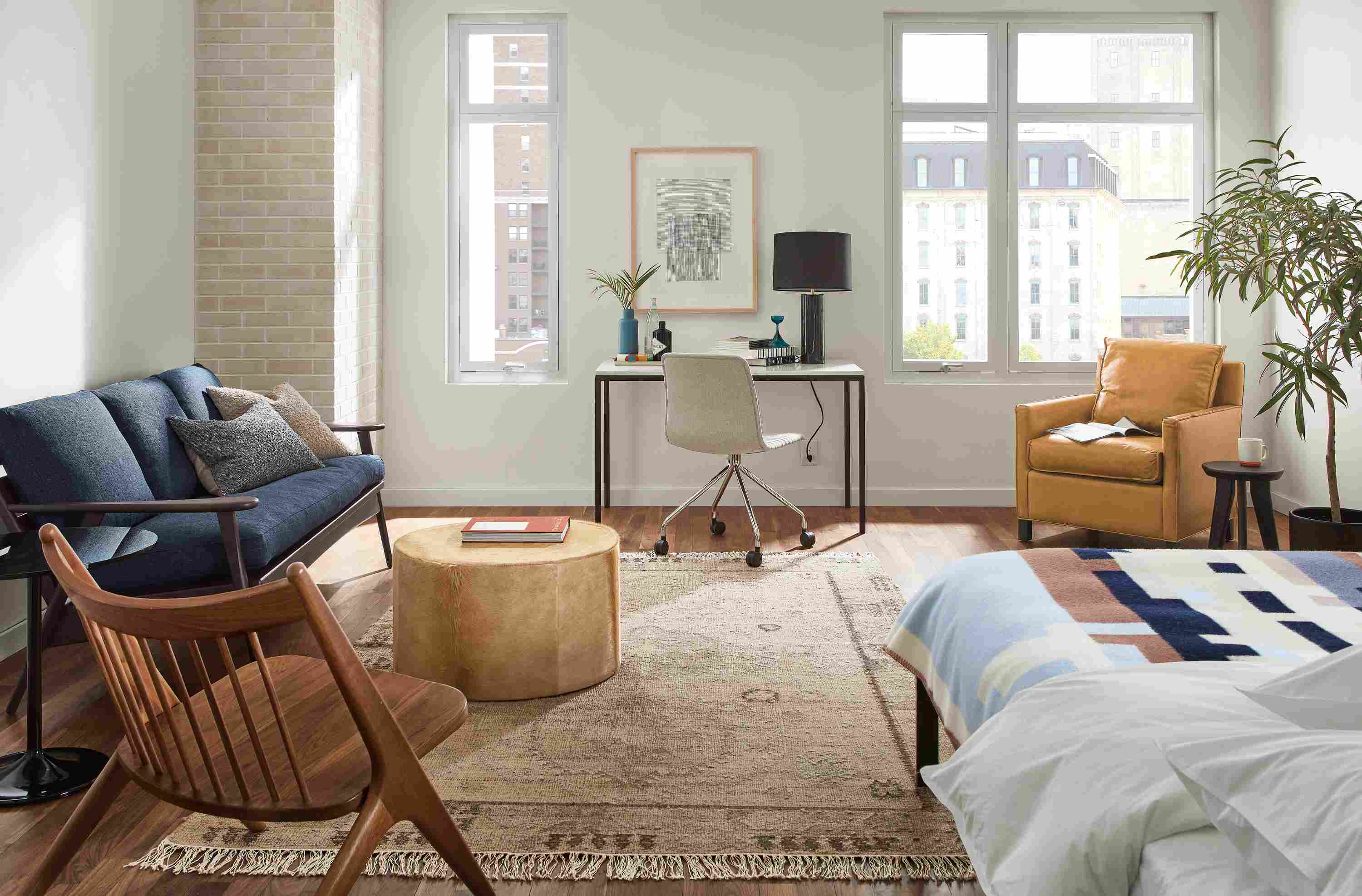 studio apartment with ericson sofa, parsons desk, core bed.