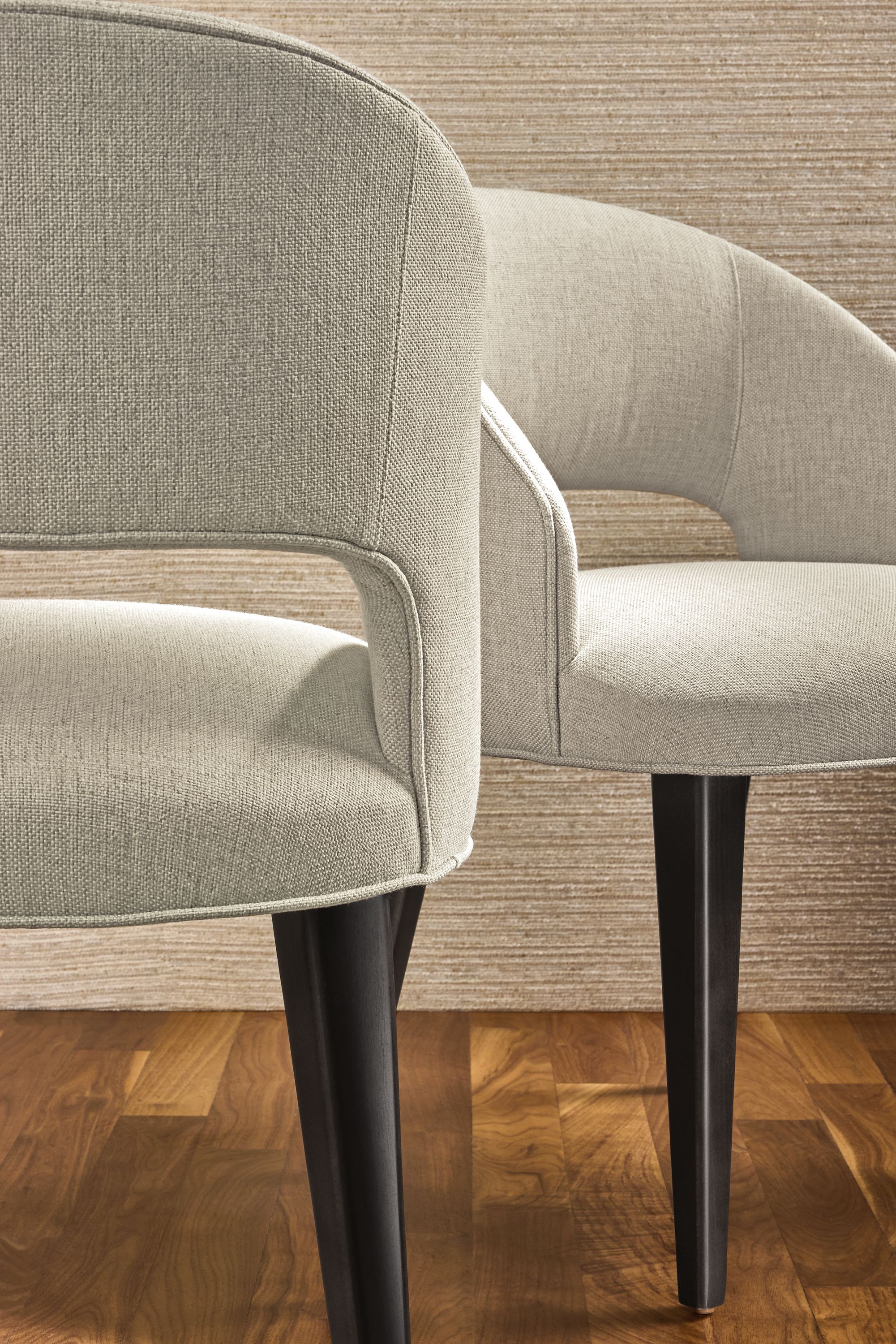 Detail of back and front of 2 Esme chairs in Sumner Linen with charcoal legs.