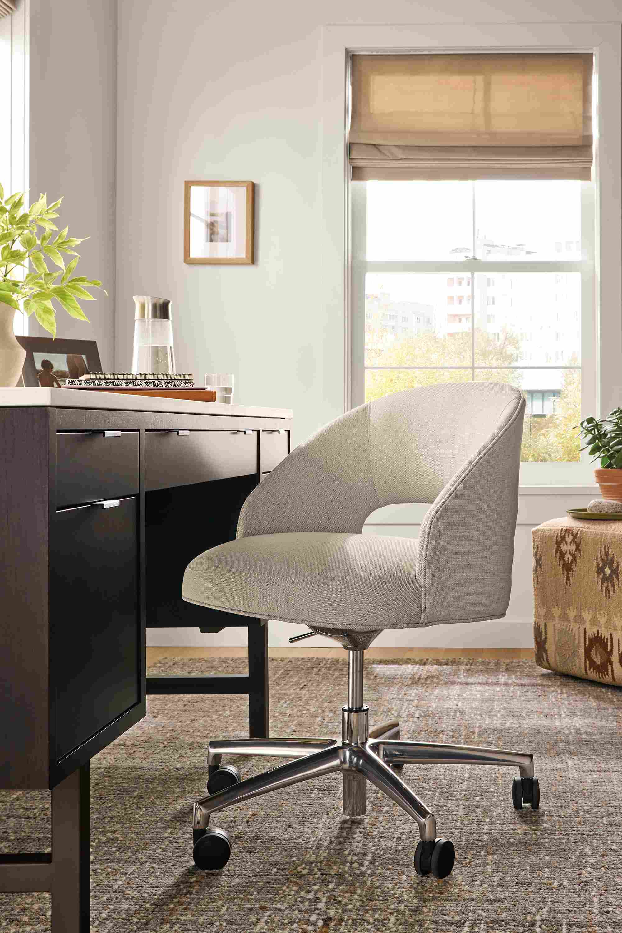 Home office with detail of Esme office chair in Sumner Linen and Copenhagen desk in charcoal.
