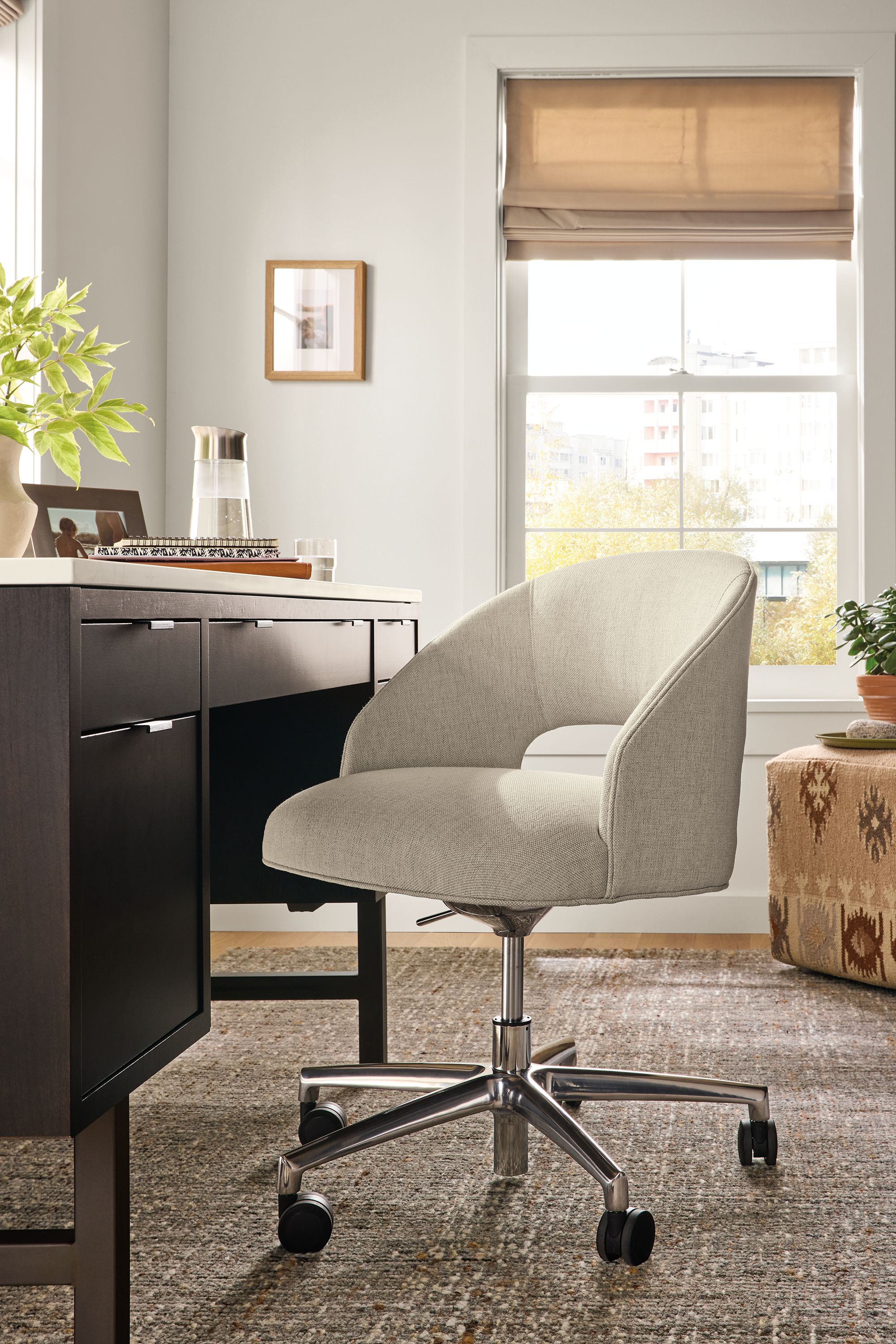 Home office with detail of Esme office chair in Sumner Linen and Copenhagen desk in charcoal.