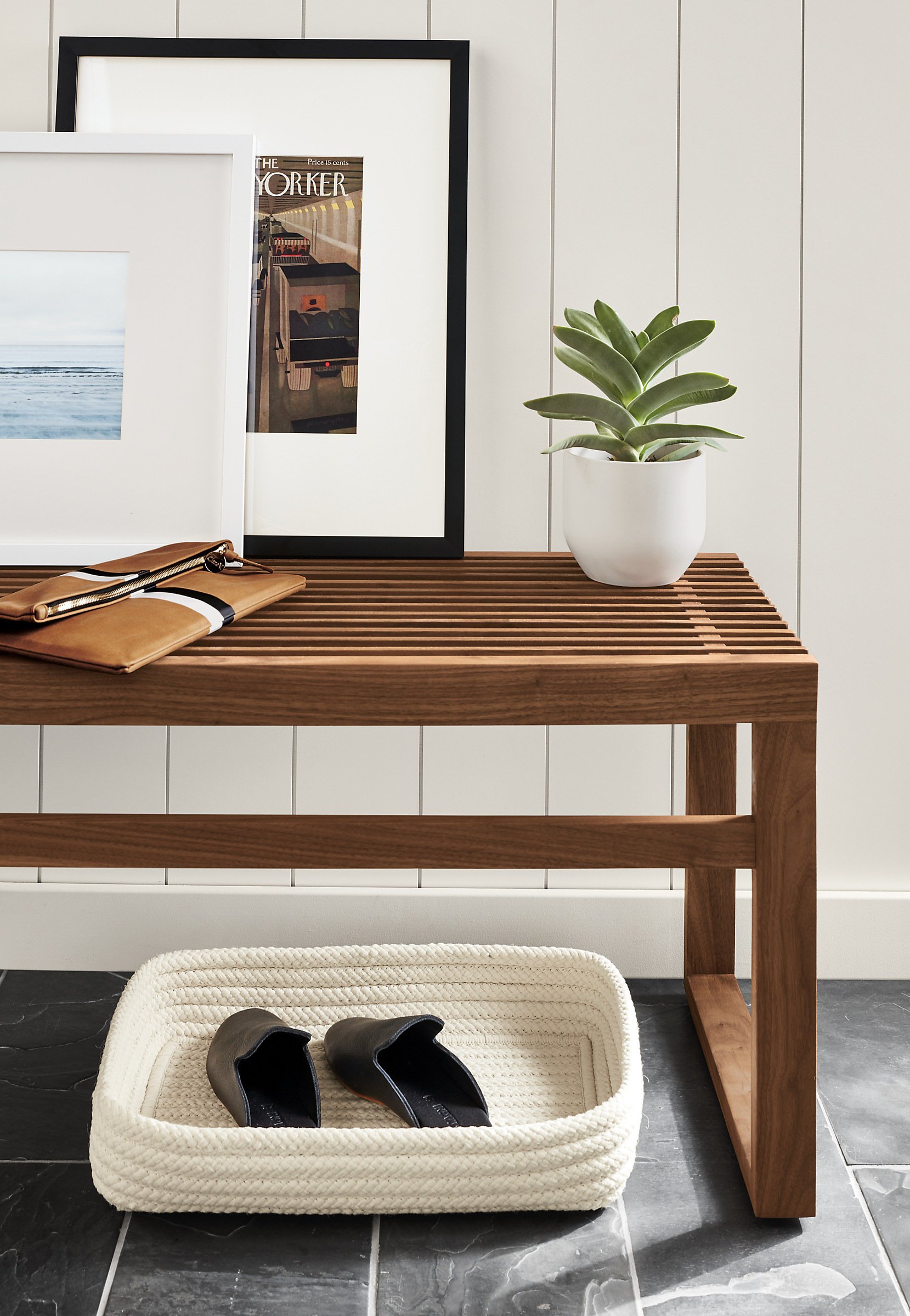 Side detail of Ewing slatted bench.