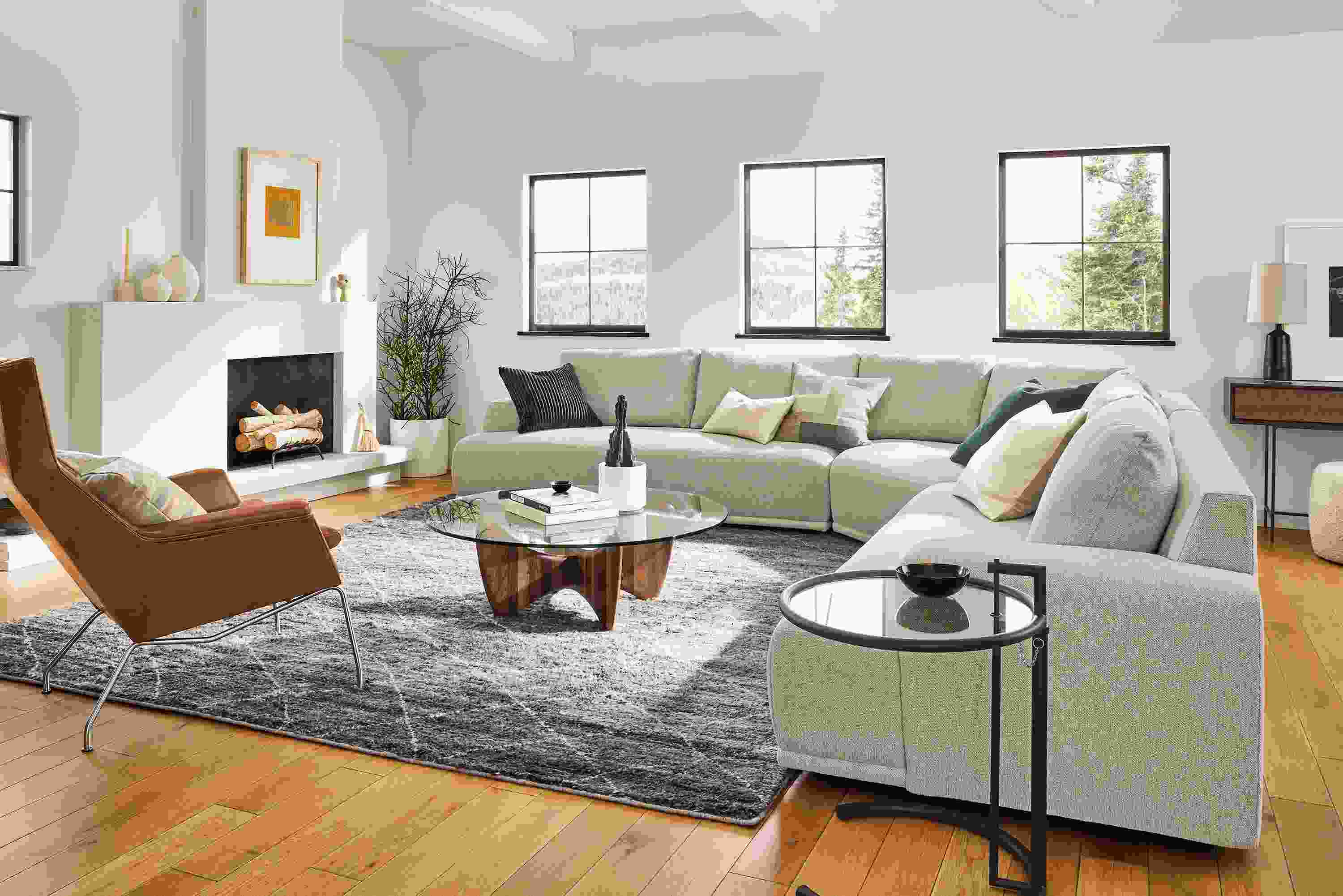 Living room with large Fia sectional, Aidan chair, Sanders coffee table, Kalindi rug.