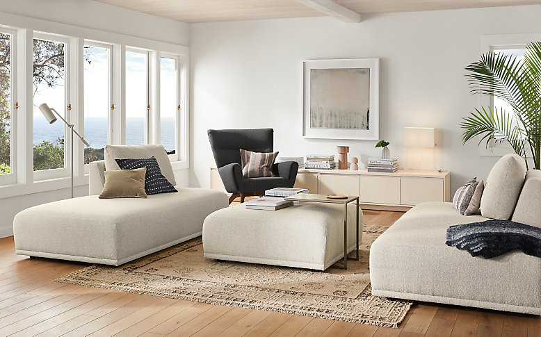 room setting with fia right-back sofa and left-back sofa with fia ottoman in middle