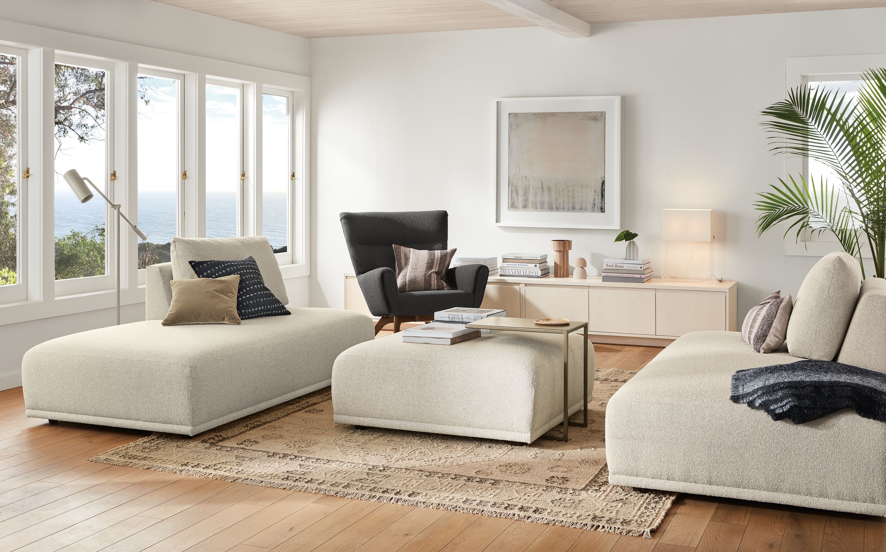 room setting with fia right-back sofa and left-back sofa with fia ottoman in middle