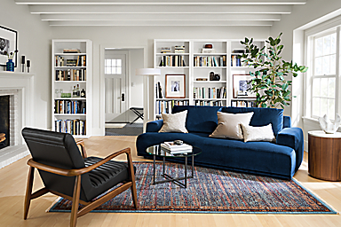 living room with fia sofa in vance indigo, callan chair, classic coffee table, anza rug.