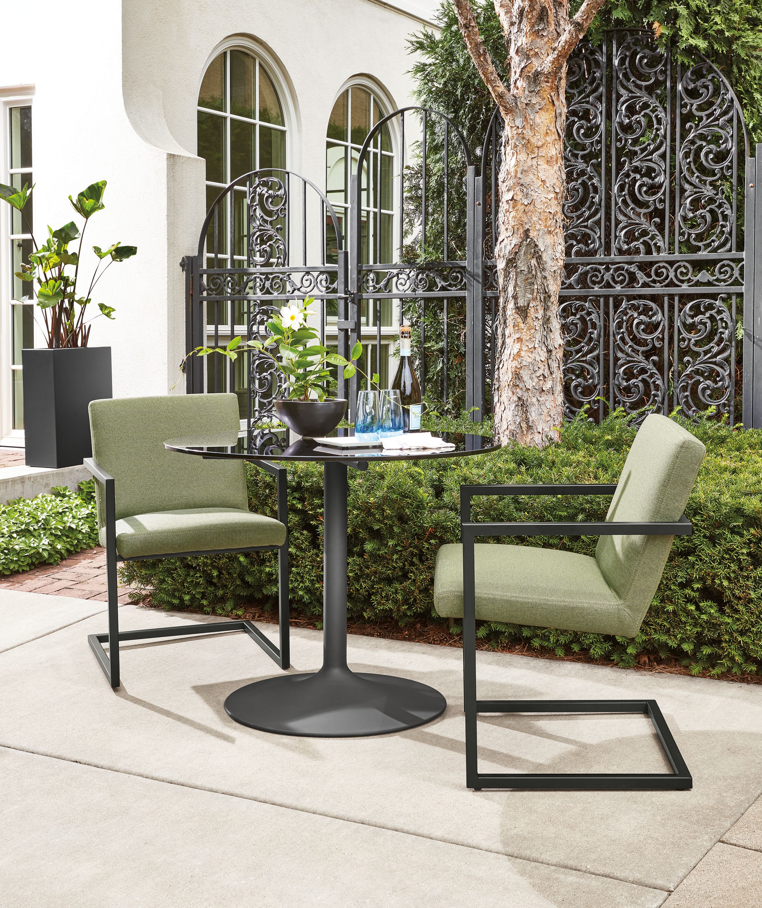 Arm chair in Pelham fern fabric with graphite frame