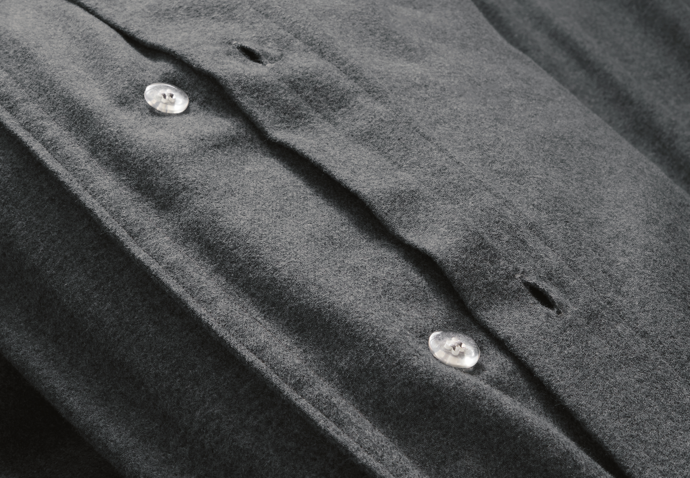 close-up of heathered flannel duvet cover button closures.