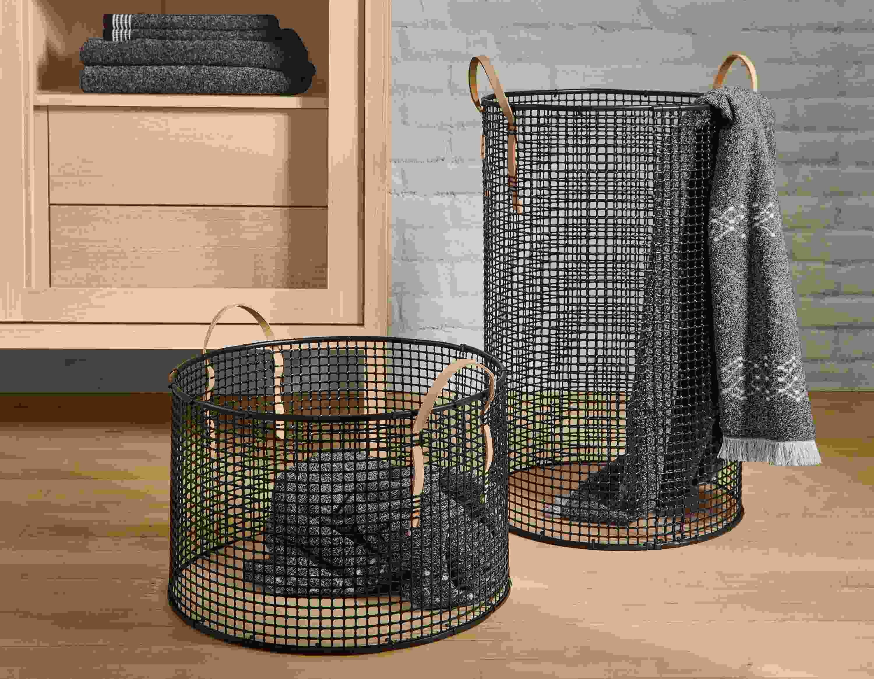 Two fletcher storage baskets in black with natural handles and path and field bath and hand towels in charcoal.