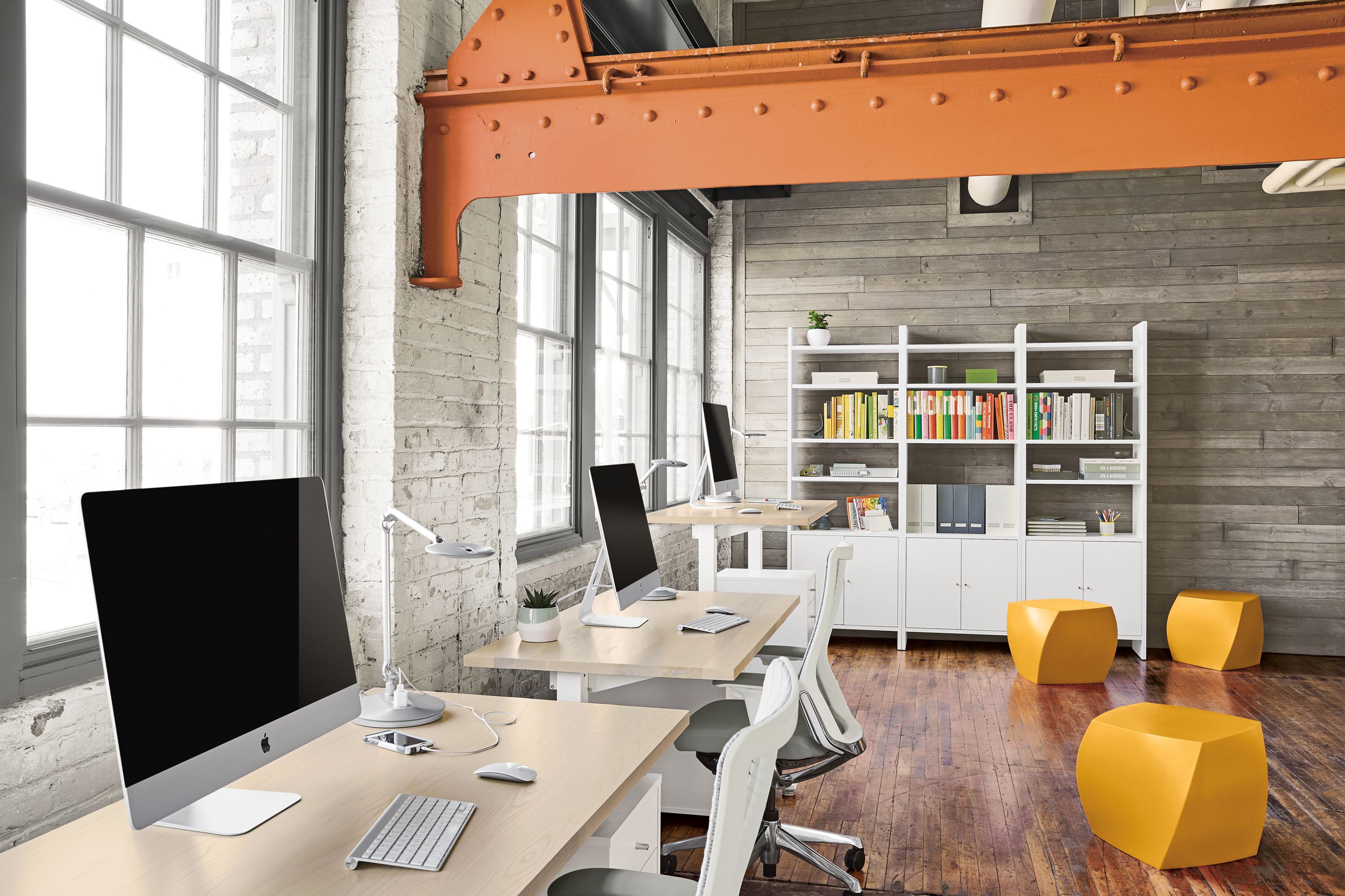 Detail of three Float desks in modern workspace.