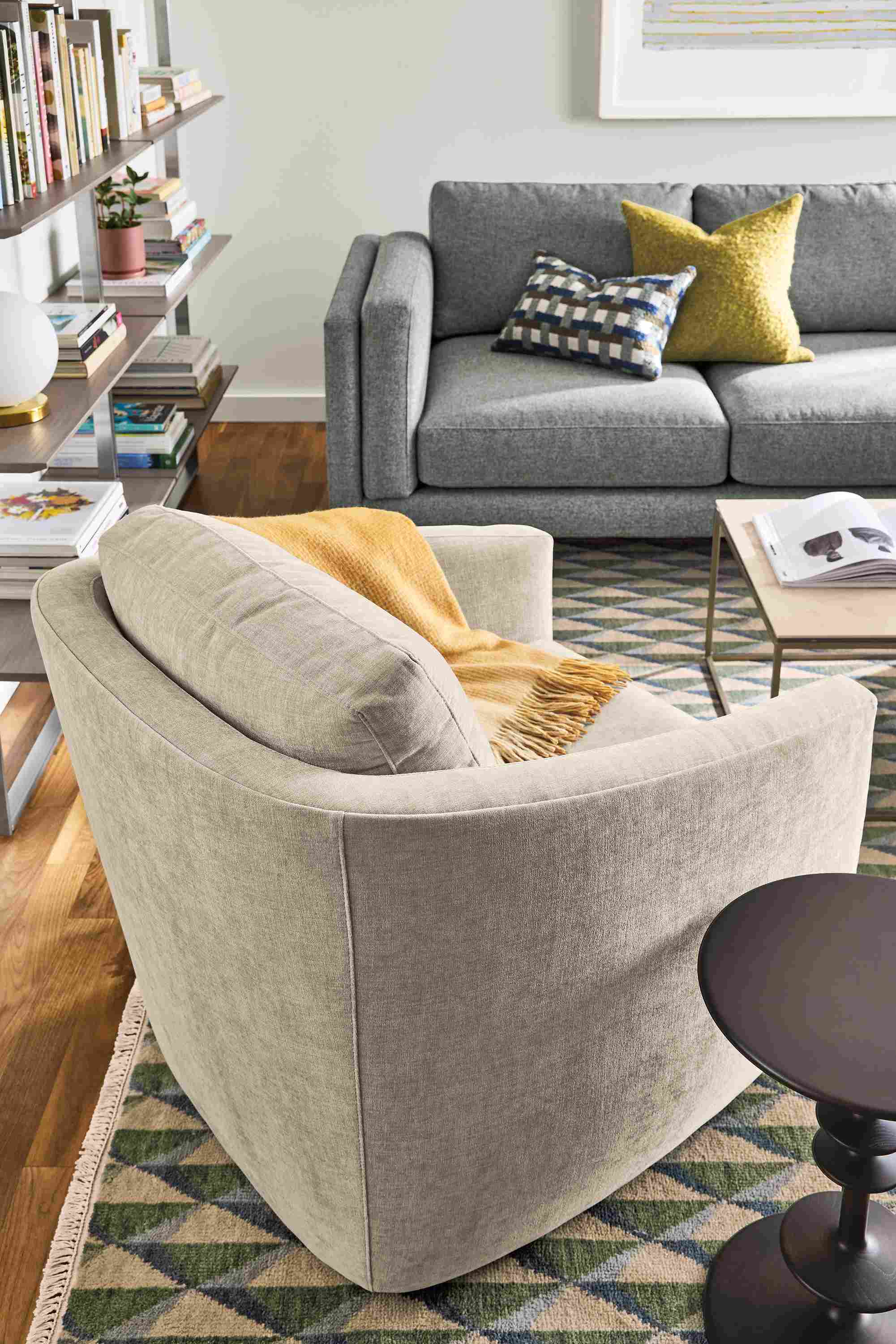 Living room with Ford chair in Mori Oatmeal, Cade sofa in Tatum Slate and Plaza 8 by 10 rug green/slate.