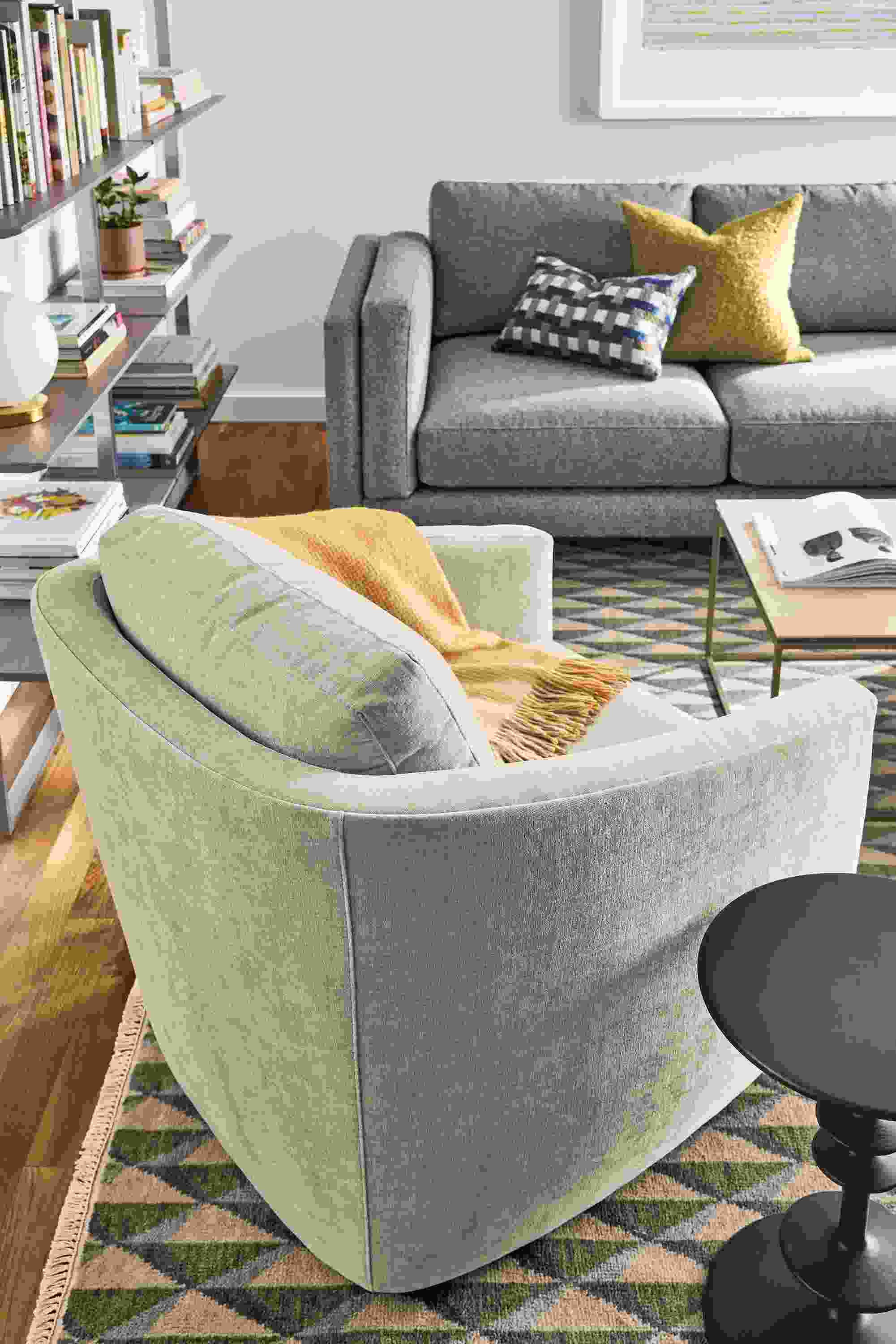 Living room with Ford chair in Mori Oatmeal, Cade sofa in Tatum Slate and Plaza 8 by 10 rug green/slate.
