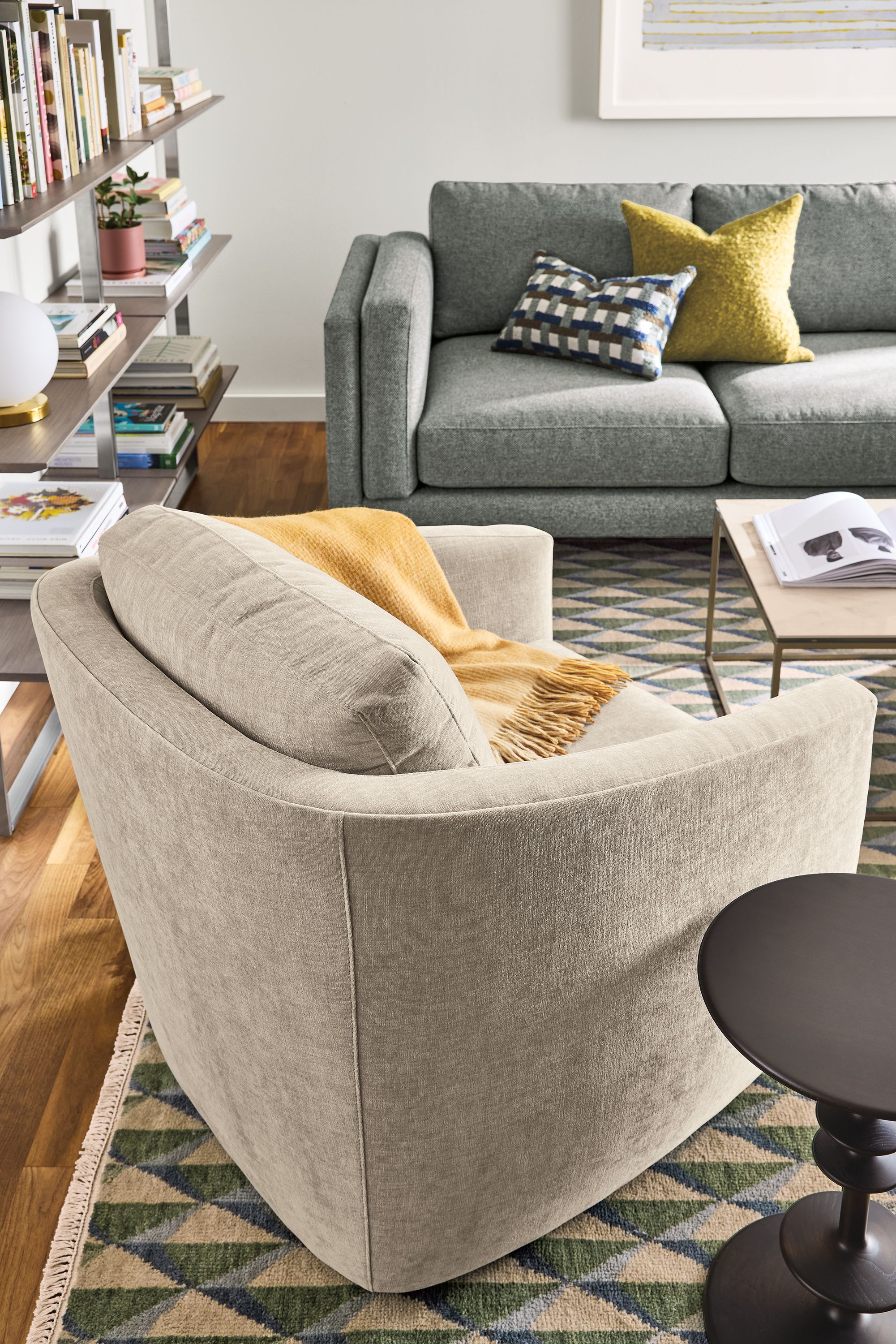Living room with Ford chair in Mori Oatmeal, Cade sofa in Tatum Slate and Plaza 8 by 10 rug green/slate.