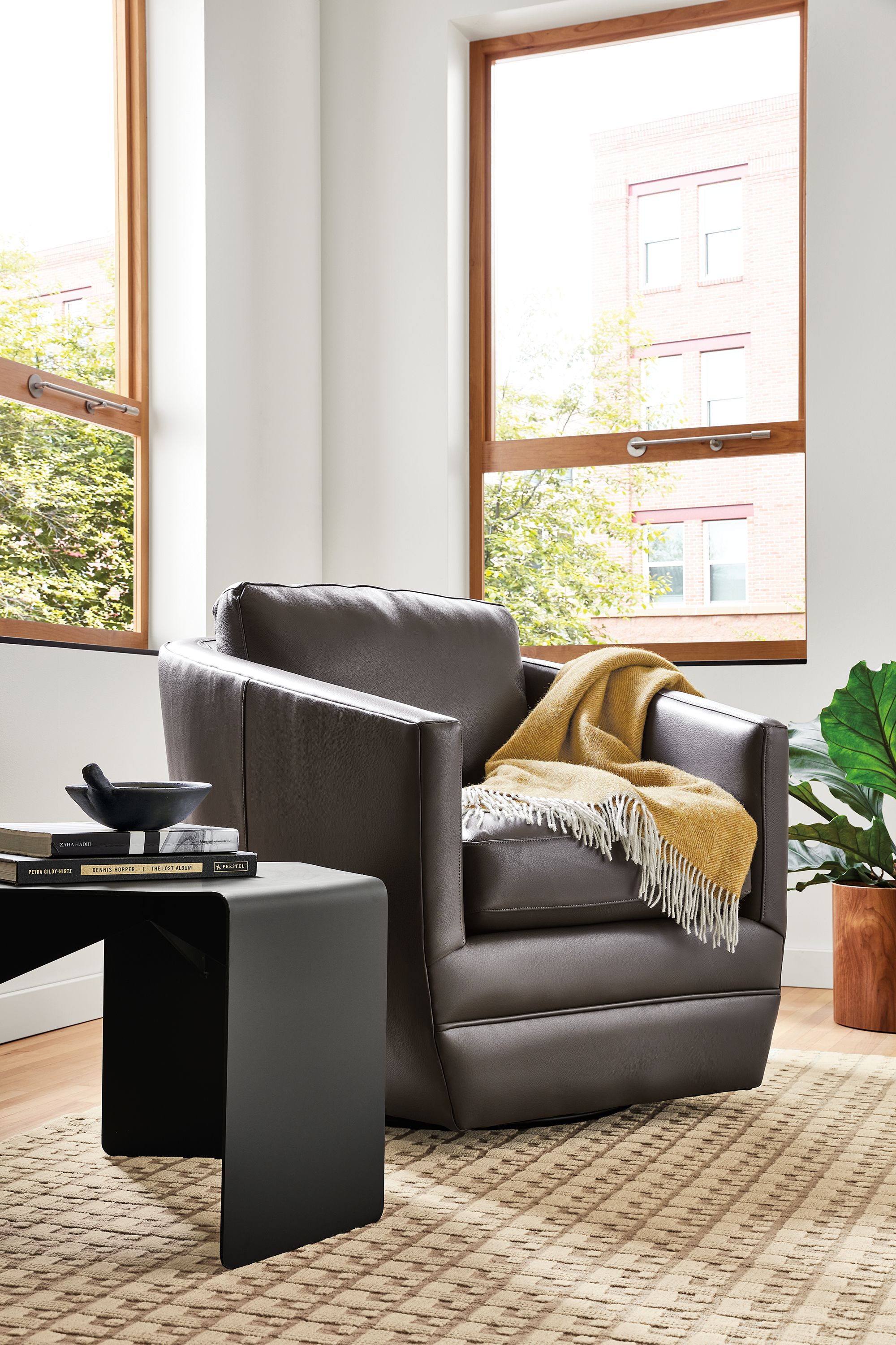 living room with ford leather swivel chair.