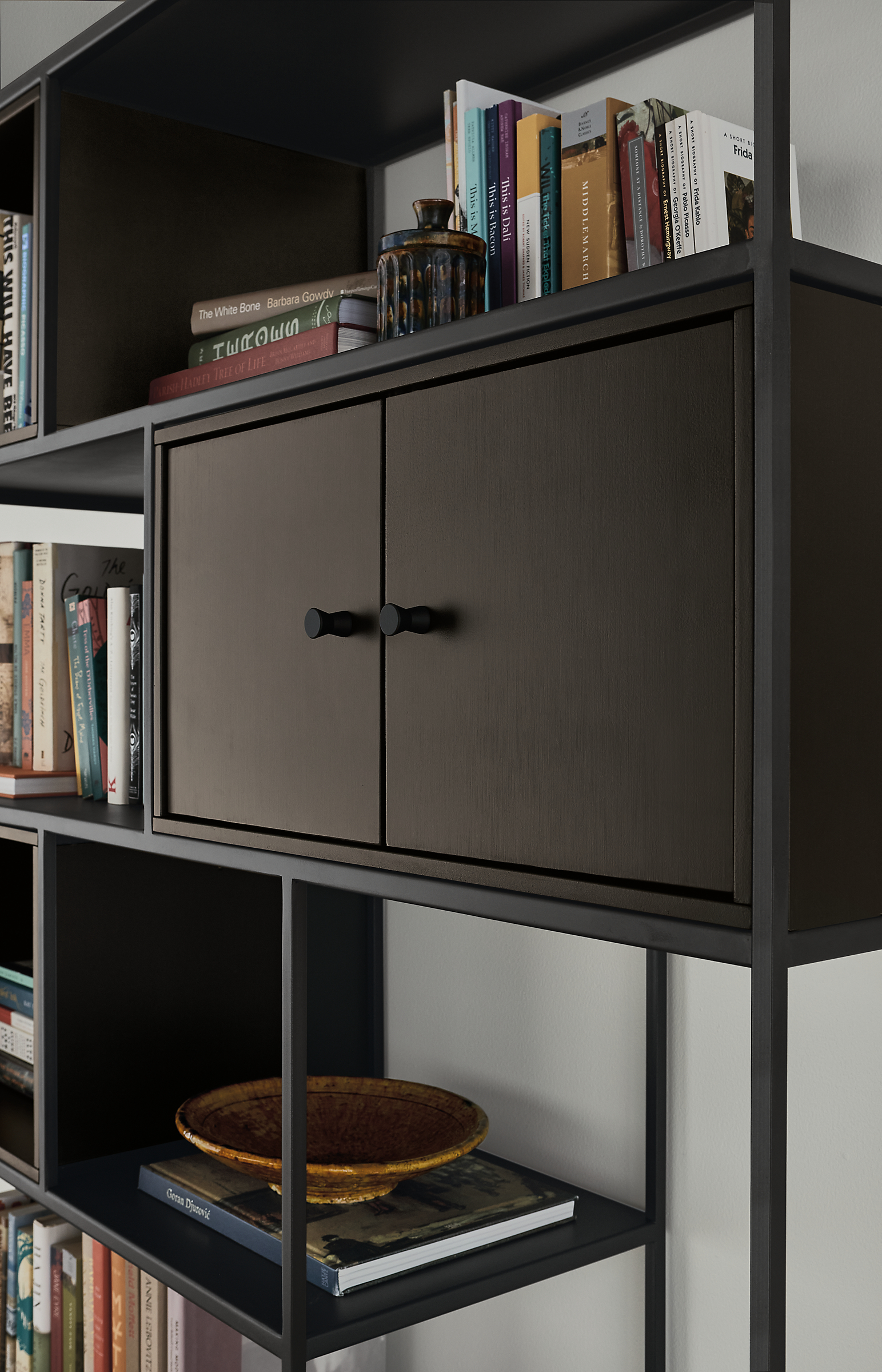 Close detail of Foshay 48-wide Bookcase in natural steel with charcoal Insert.