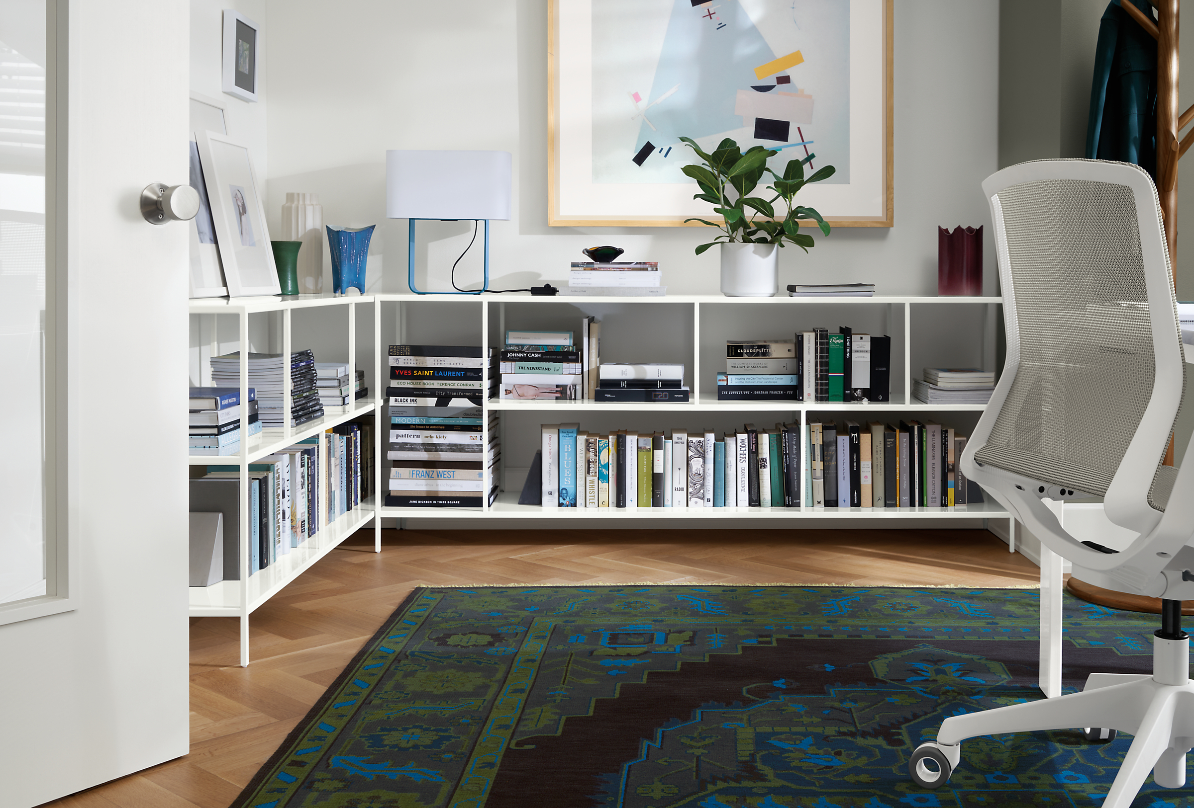 office with foshay console bookcases in white, cynara office chair, heriz rug.