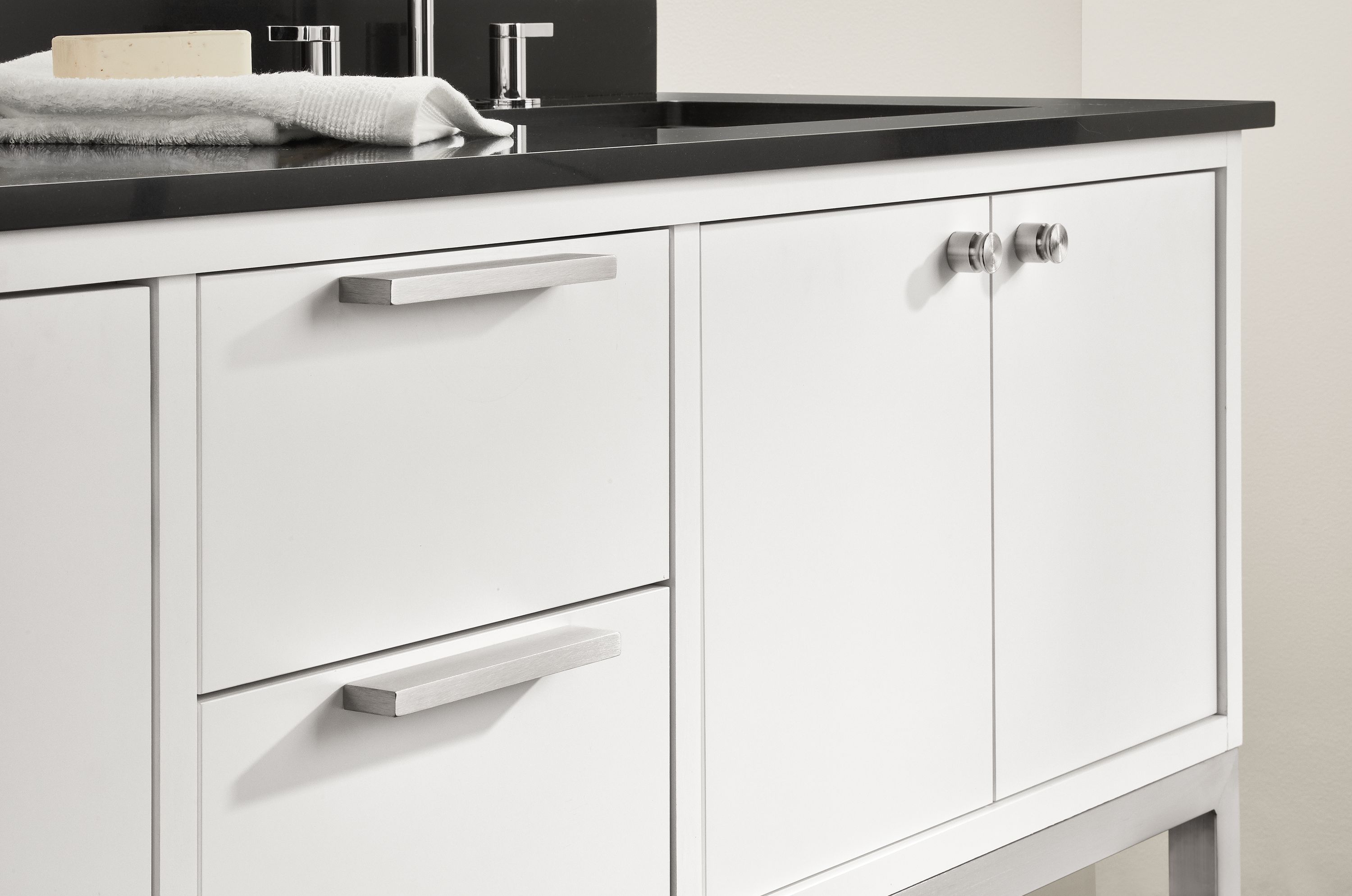 Shown on drawers: Fredrik 7.25w Slab Pulls in stainless steel