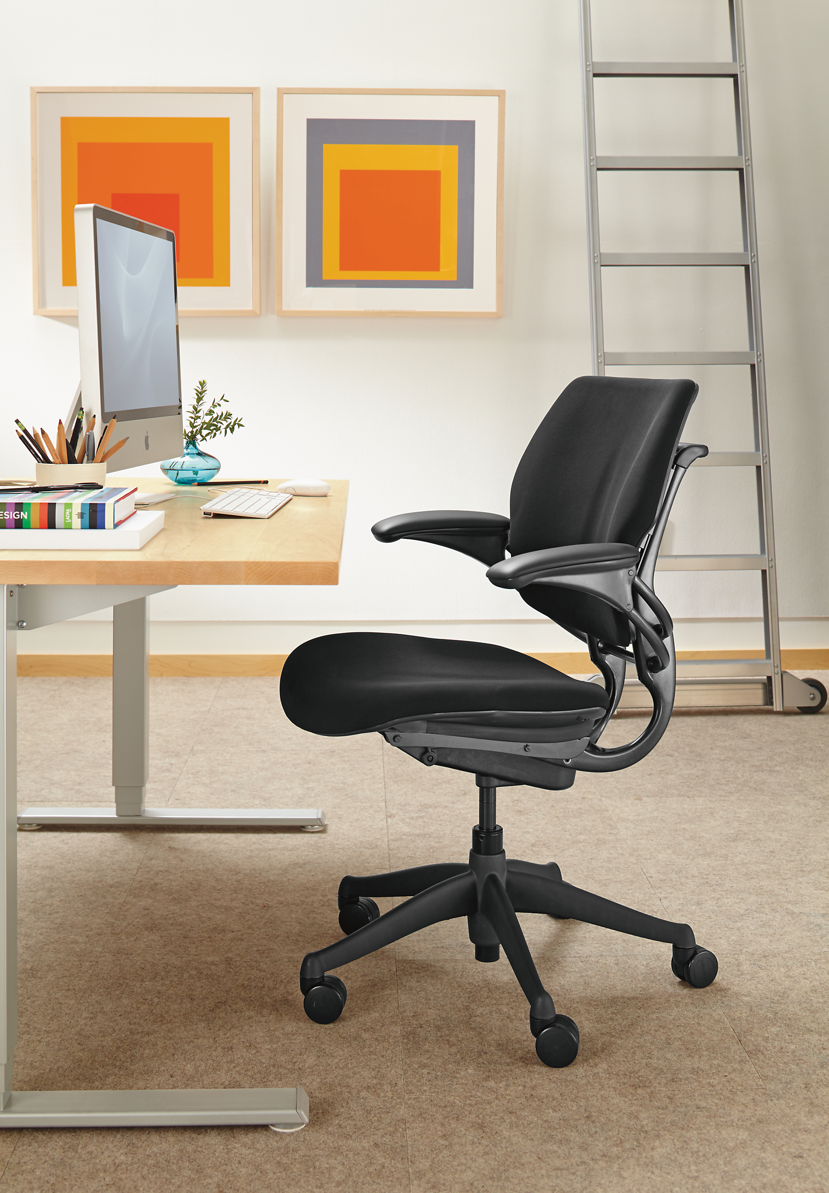 Side detail of Freedom office chair in black.