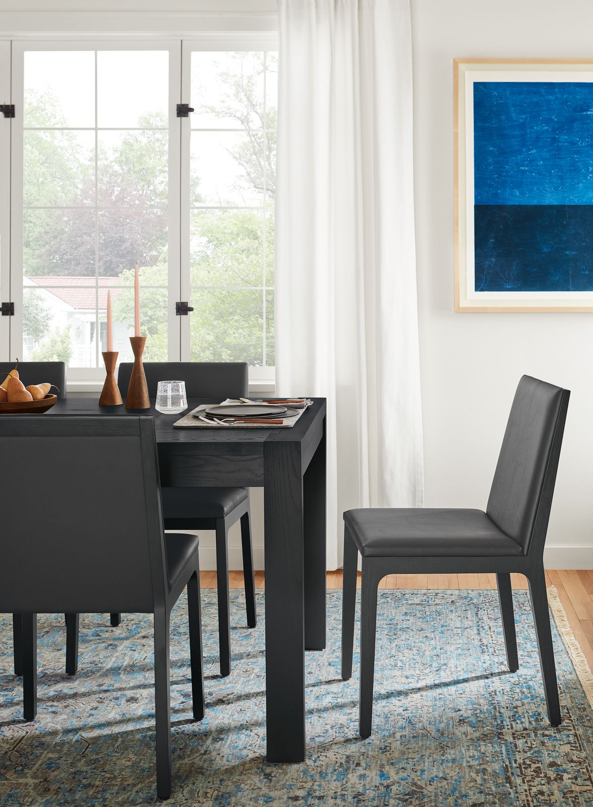 room setting with walsh table in black and gabriel side chairs in black