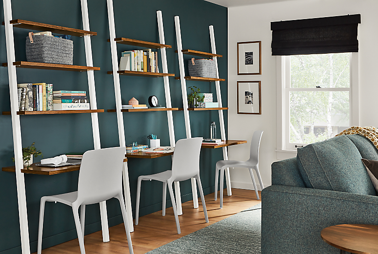 Room setting of 3 Gallery Leaning Desks in White with Walnut shelves and 3 Tiffany Side Chairs in Grey.