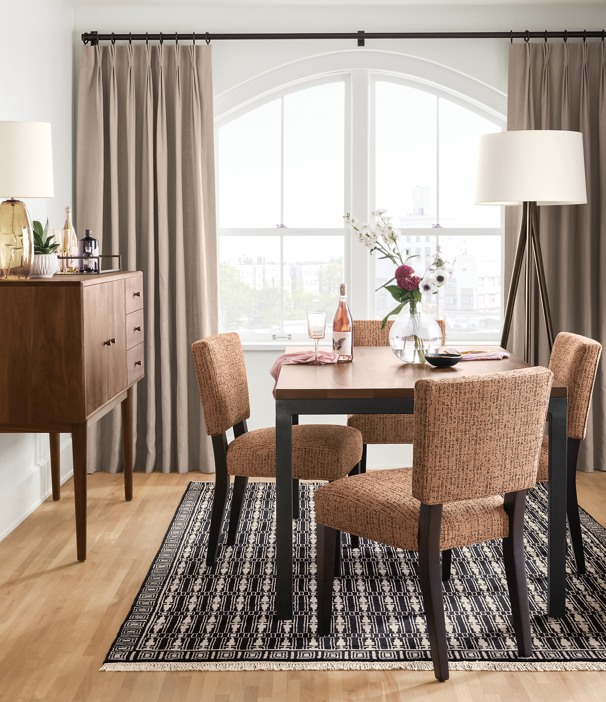 Detail of 4 Georgia side chairs in Sym Blush fabric in small dining room.