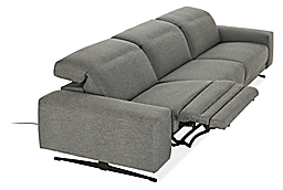Detail of Gio 3 piece sofa with power in fabric shown in mid recline position with headrest lowered position.